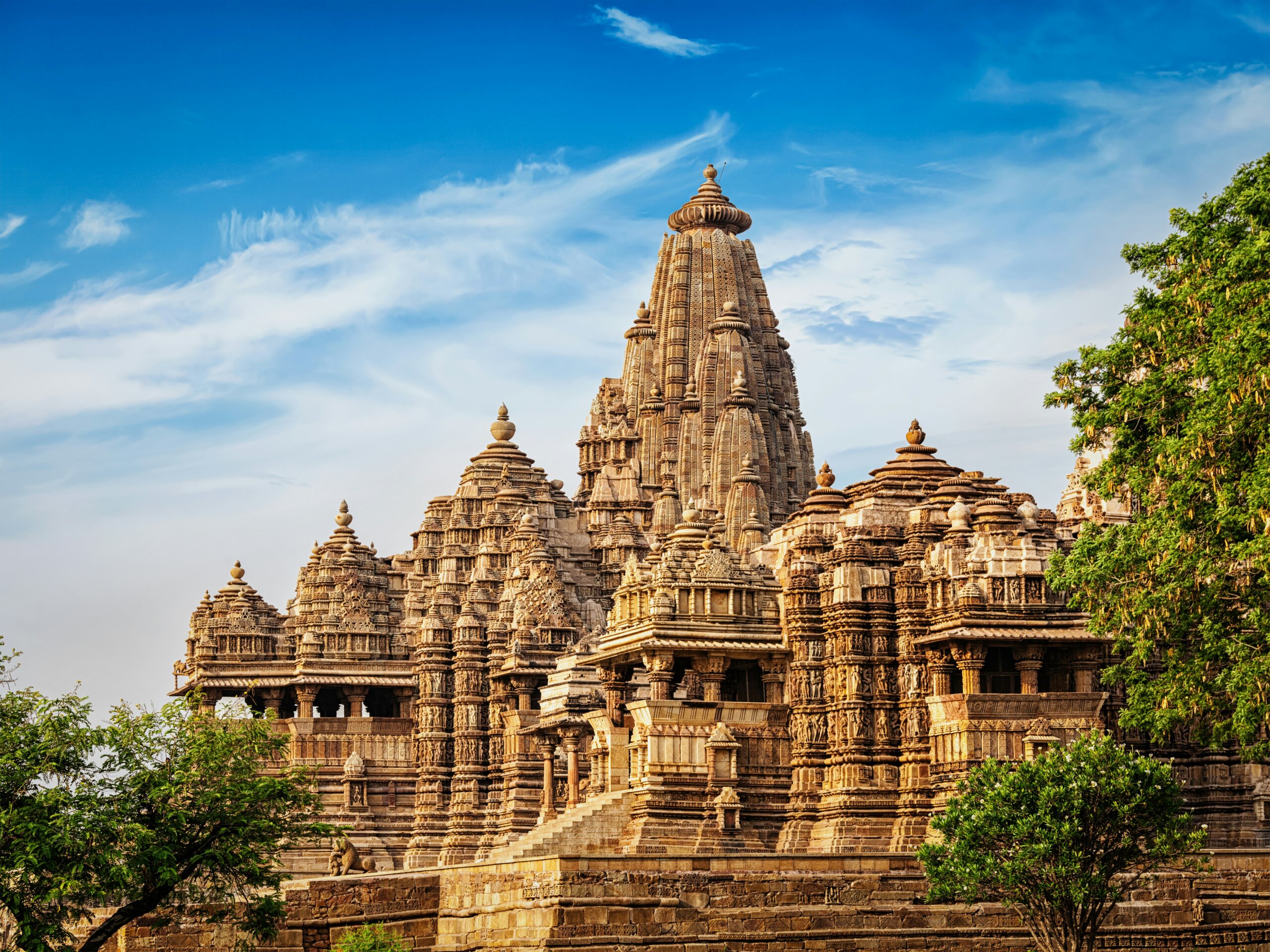 Ancient Khajuraho temple with detailed stone carvings — one of India’s historic UNESCO World Heritage Sites and a must-see when traveling in India.
