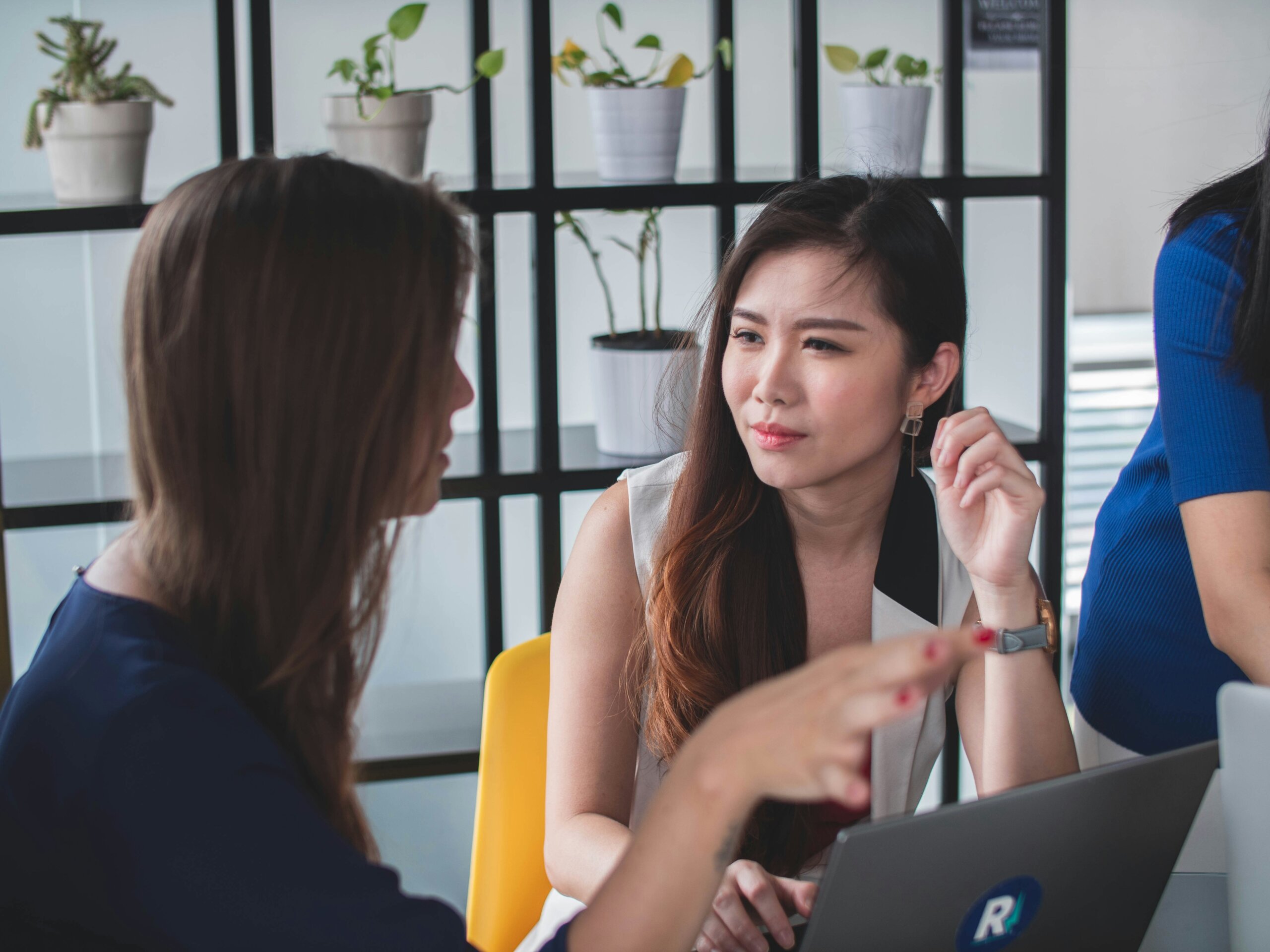 Two women in conversation — representing why starting with “You people…” followed by a generalization can come across as stereotyping when abroad.