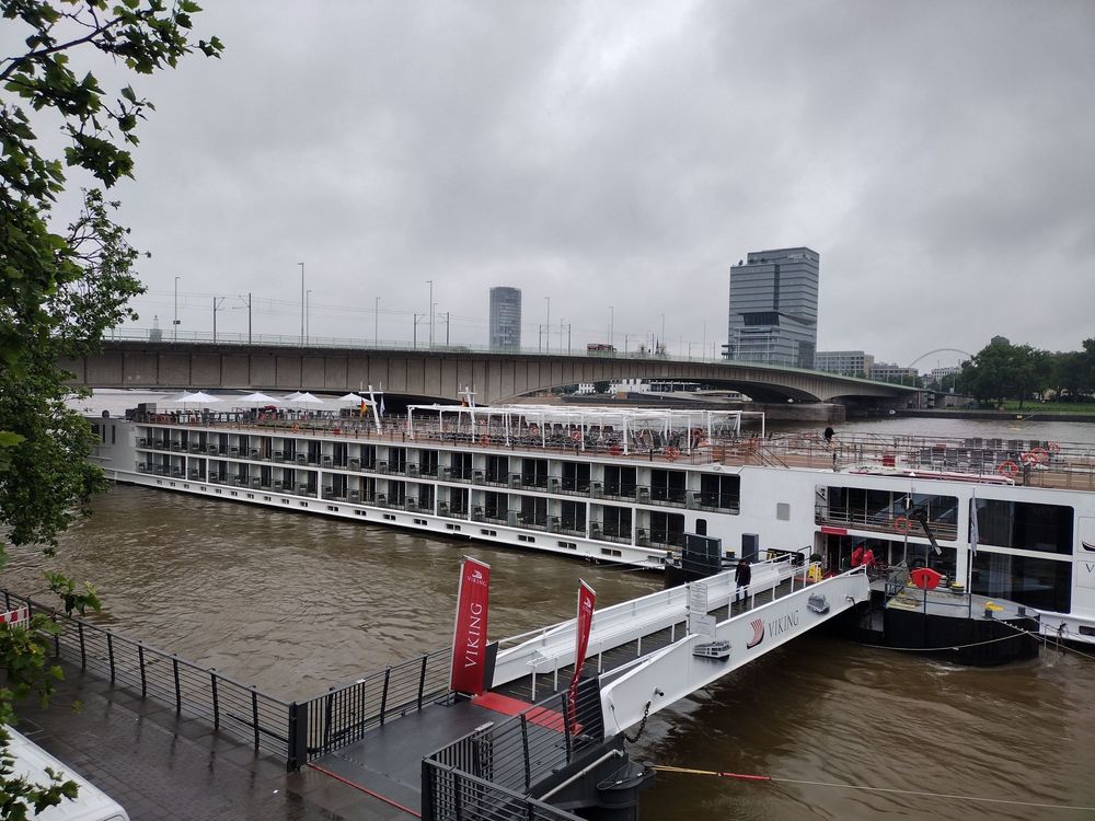 Viking river cruise ship docked at a city port, showing easy accessibility for passengers.