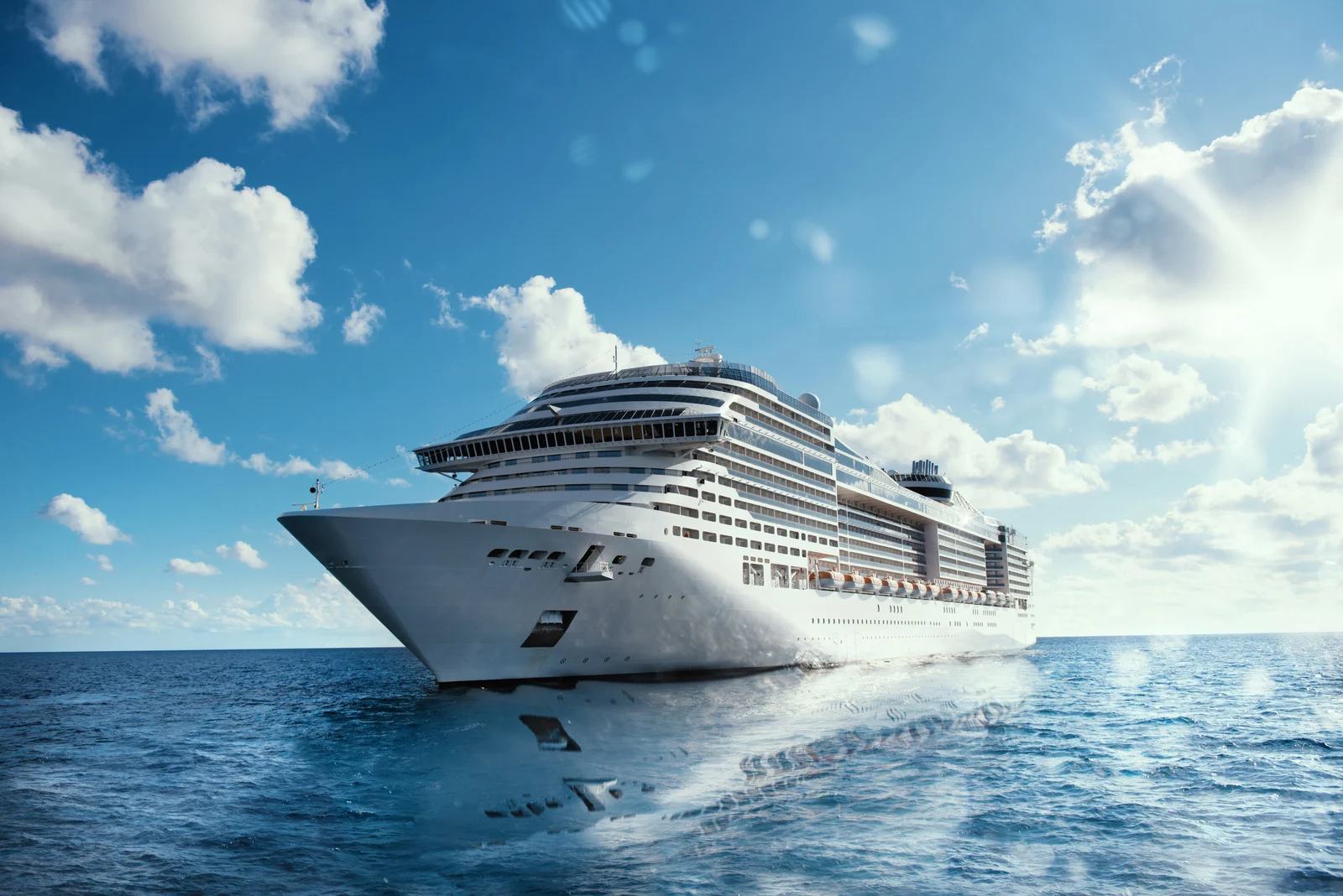 Large luxury cruise ship at sea under a bright sky, symbolizing adult-only cruises without casinos or kids.