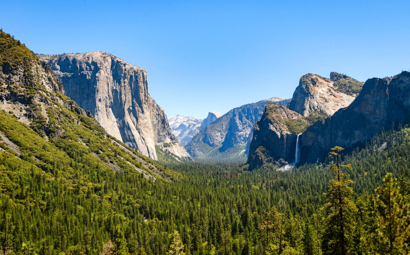 Panoramic view of Yosemite Valley from Tunnel View with El Capitan on the left, Bridalveil Fall on the right, and Half Dome in the distance