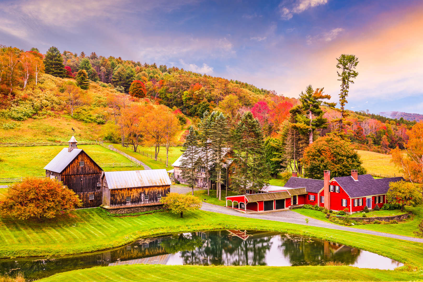 Quaint farm surrounded by fall folliage in Woodstock, Vermont