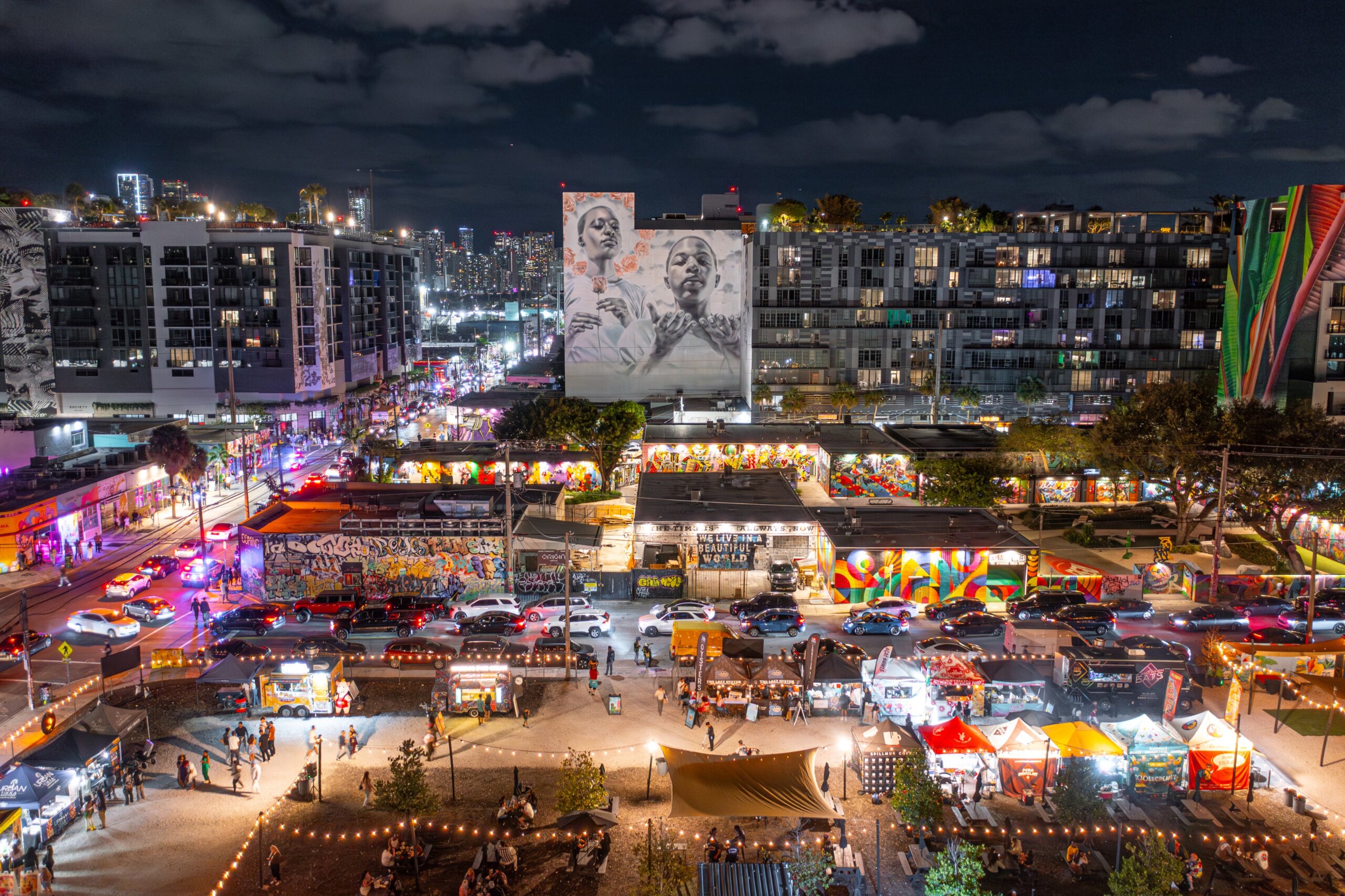 Smorgasburg Wynwood Walls , Miami, Florida, USA - 1/06/2025: Nighttime aerial shot of Smorgasburg by Wynwood Walls in Miami. Smorgasburg is one of the largest weekly open-air food market in America.