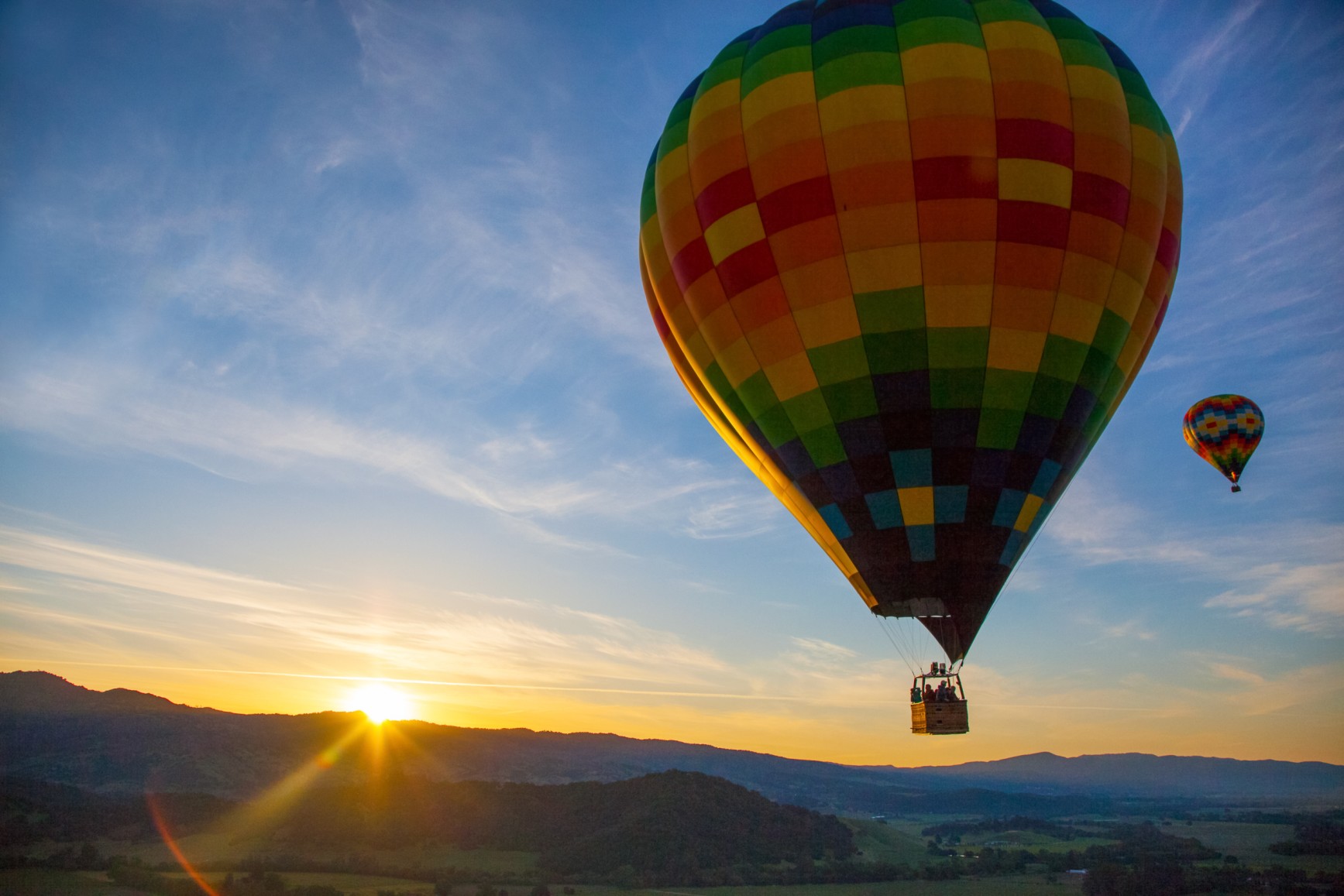 Hot Air Balloon Over Vineyards At Sunrise Over Napa Valley, Napa, California USA
