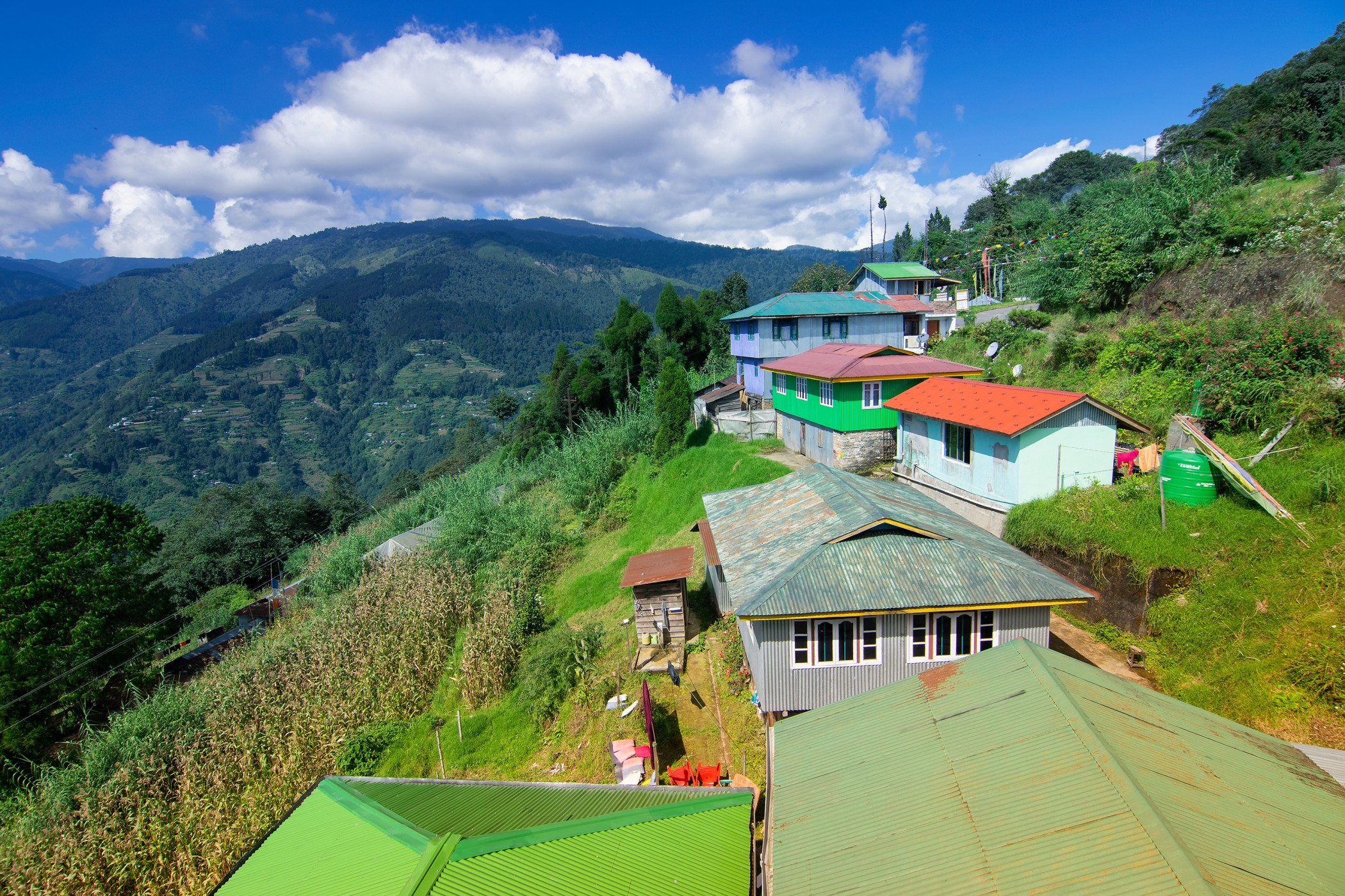 Okhrey village, Himalayan mountain range in the background . Okhrey is a remote village with breath taking scenic natural vista of world famous Himalayan Mountains in background, in Sikkim, India.