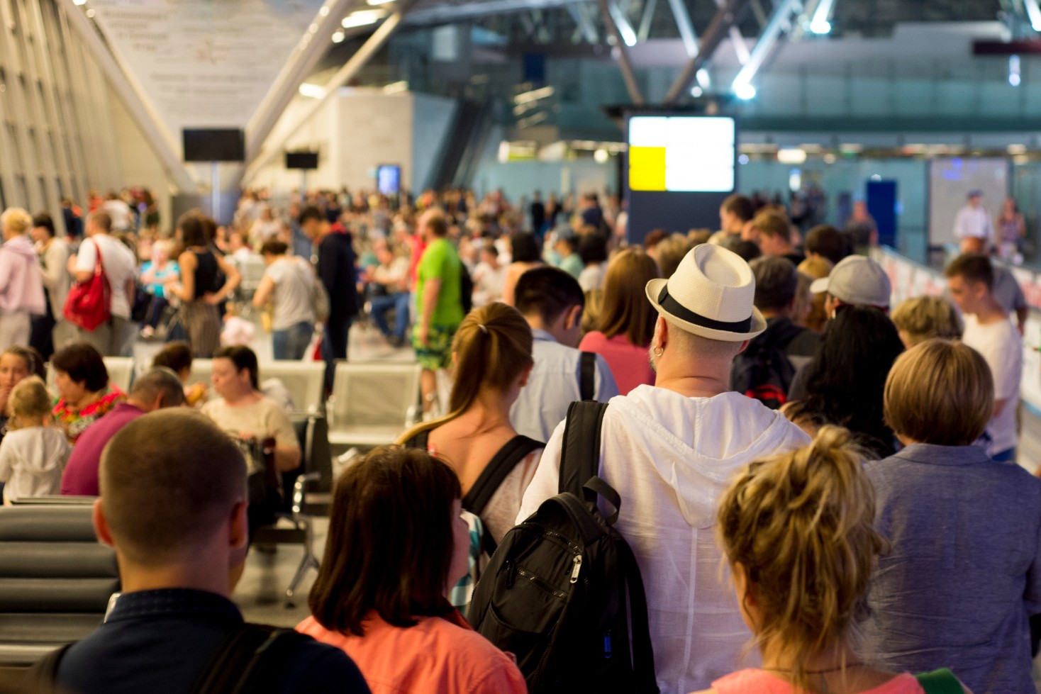 Closeup Queue of Europen people waiting at boarding gate at airport
