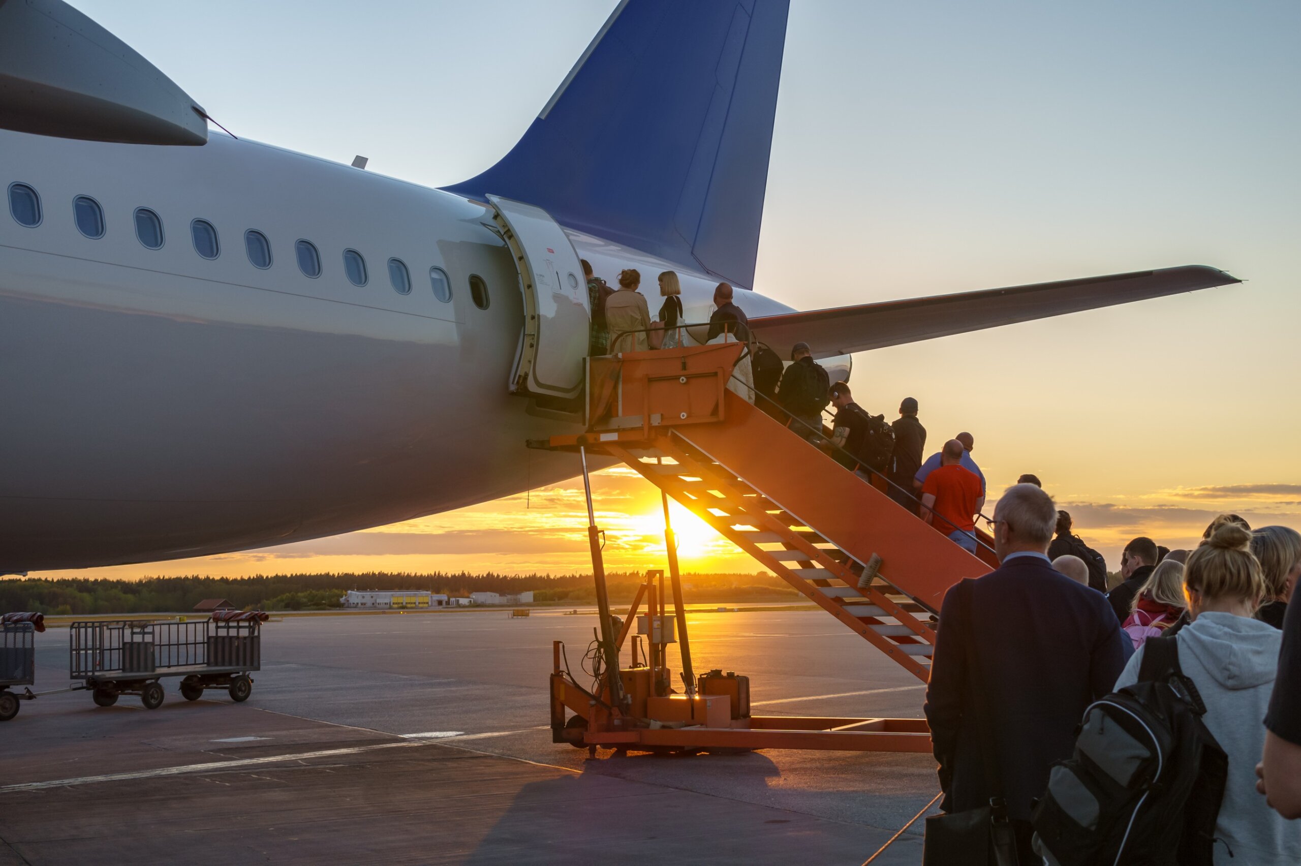 People boarding plane, travelers