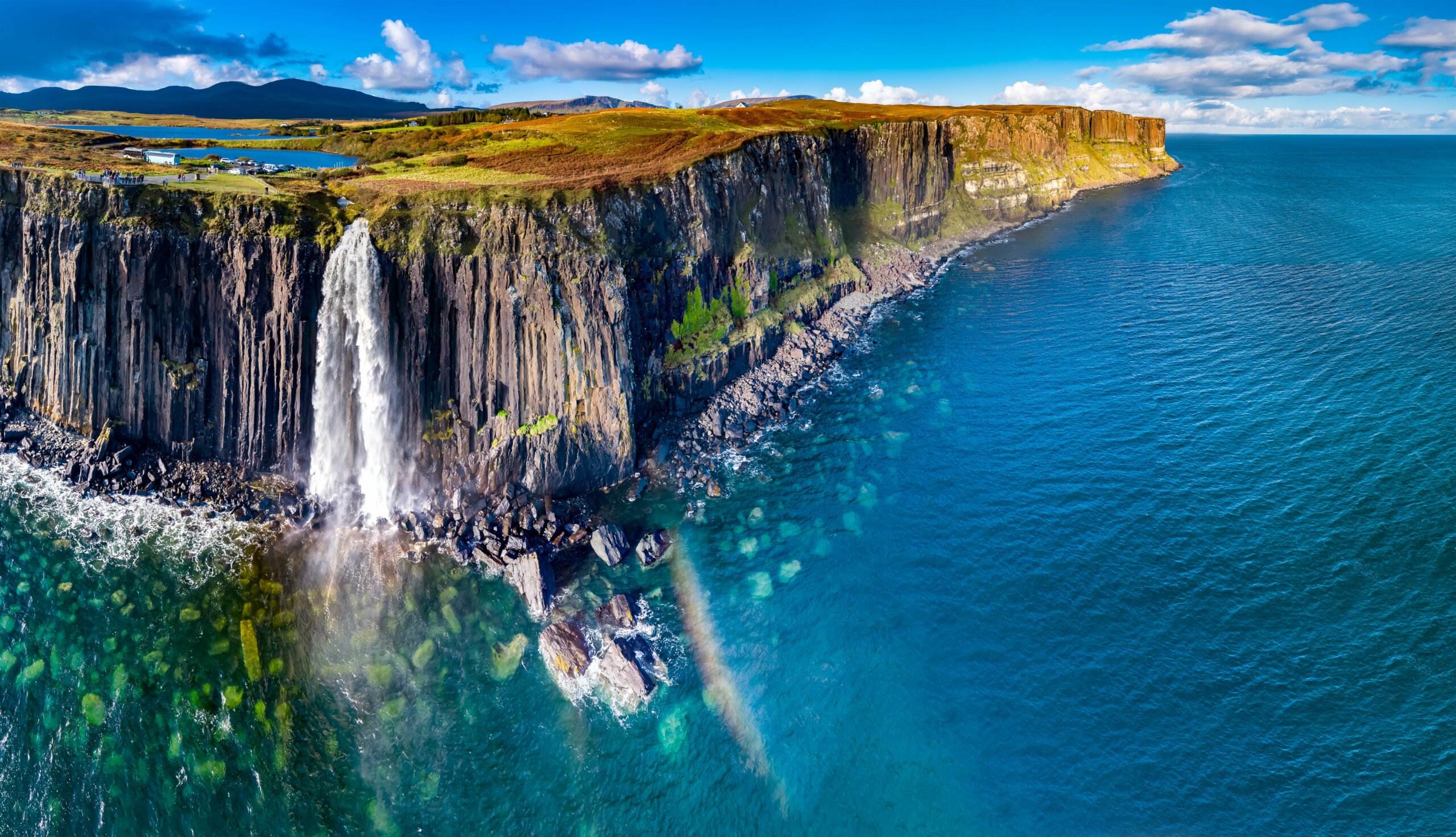 Aerial view of the dramatic coastline at the cliffs by Staffin with the famous Kilt Rock waterfall - Isle of Skye - Scotland
