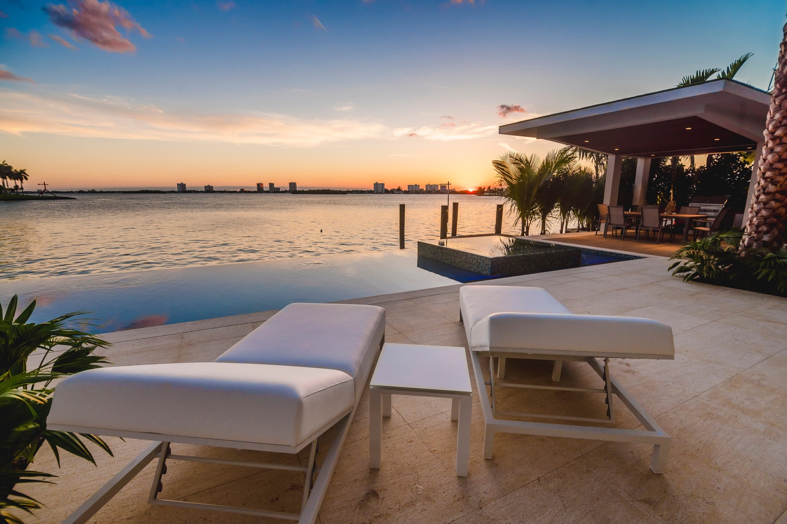 Sunset scene by the infinity and a beauty view of the bay in Miami
