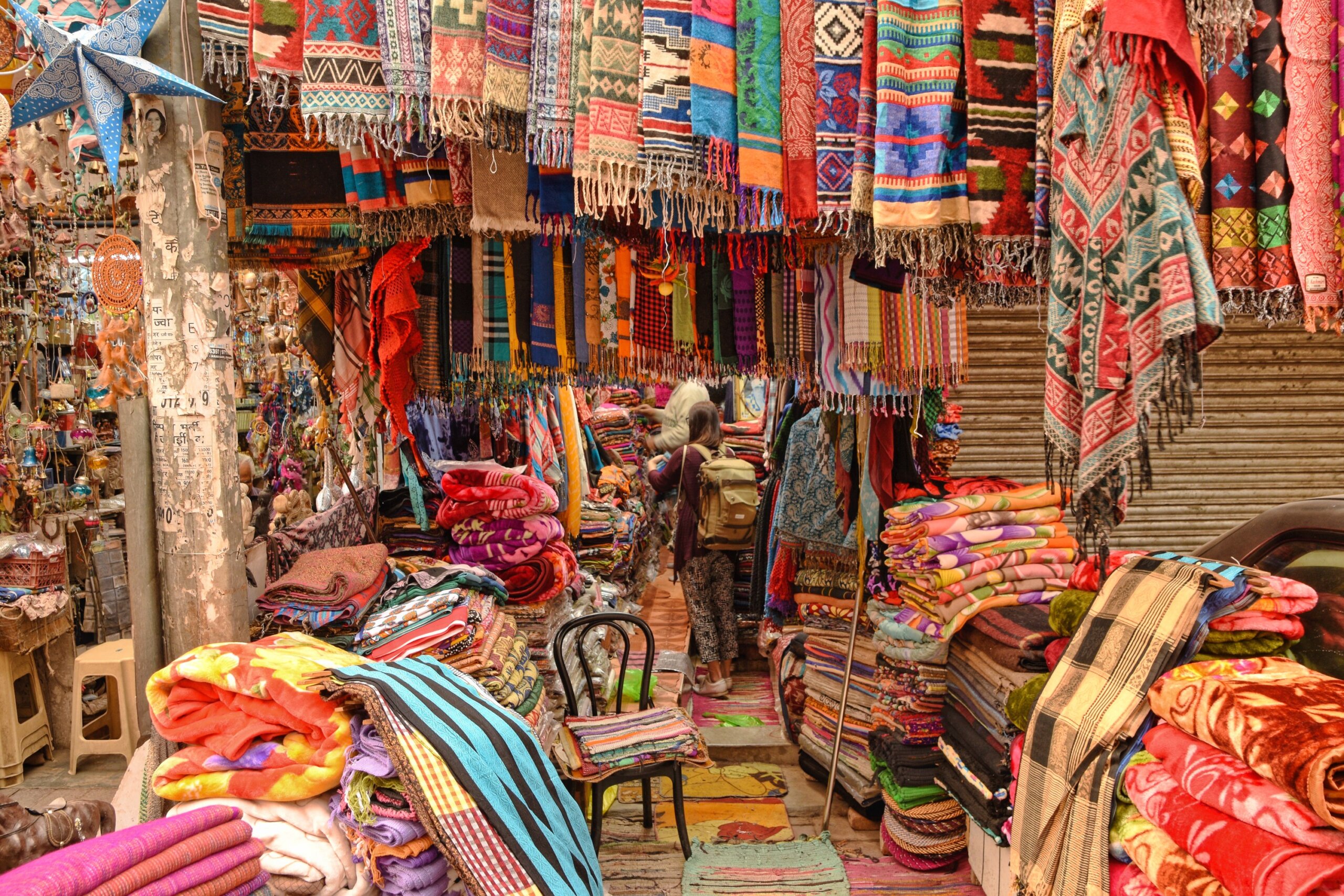 Buying scarfs at the old market in New Delhi
