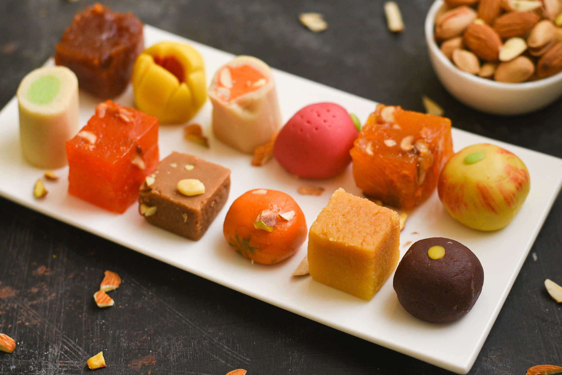 Indian sweets, Diwali sweets mithai milk Peda and Halwa or Halva, flavored variety of assorted dessert served as gift on Deepavali, Pongal, Dussehra, Durga Pooja, Holi, Diwali festival in Delhi India.