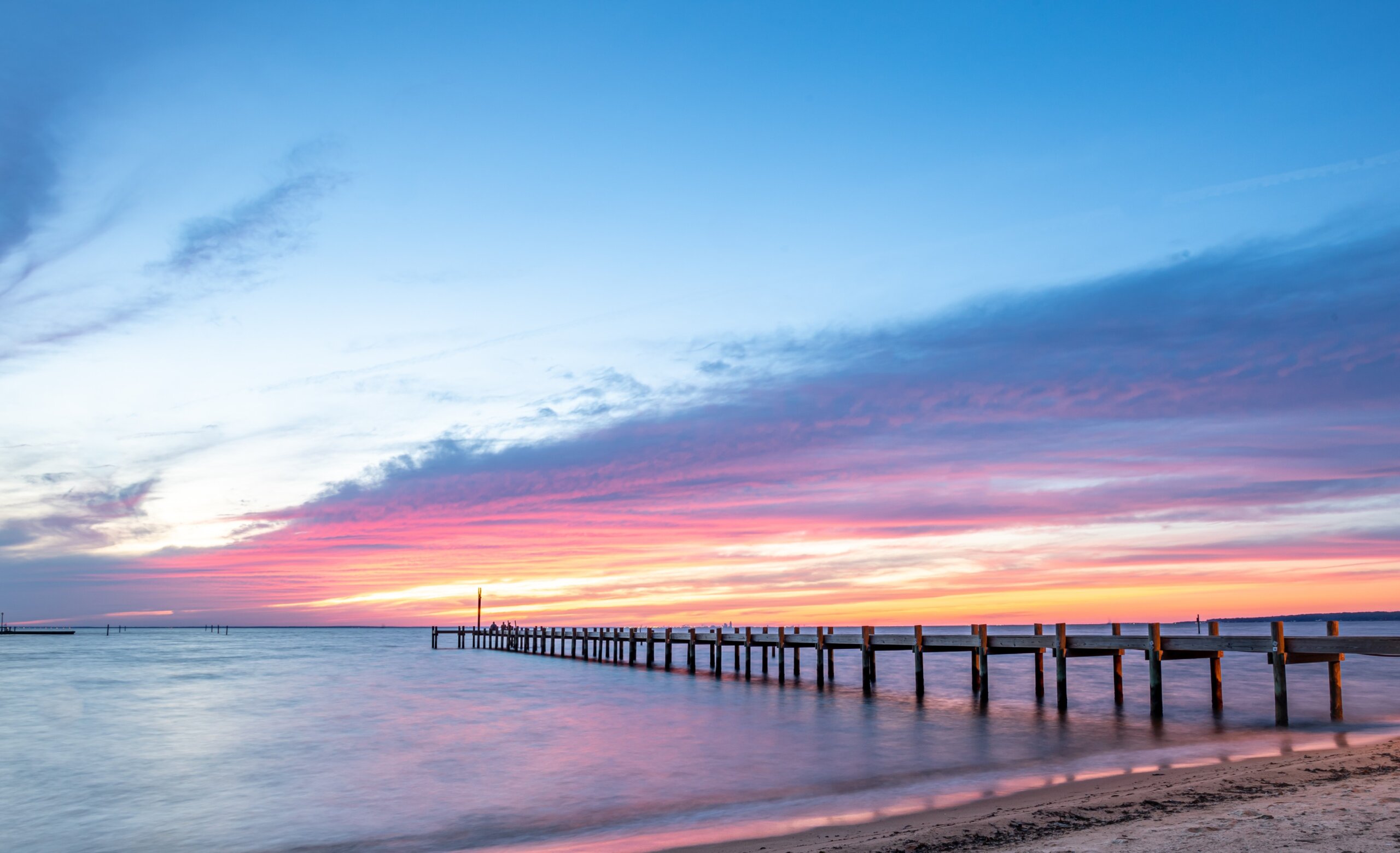 A Pier at Fairhope View during sunset

