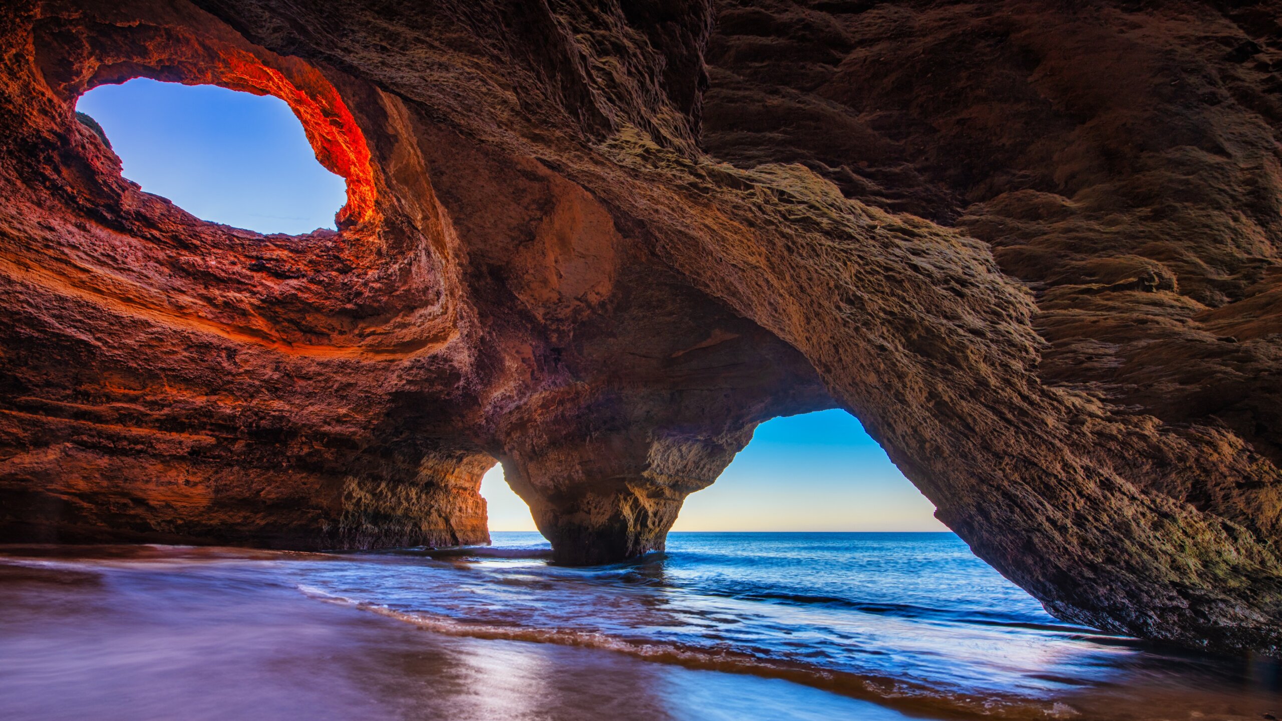 long-term travel fatigue - Spectacular sunset view of the Benagil Sea Cave in Algarve, Portugal, Europe