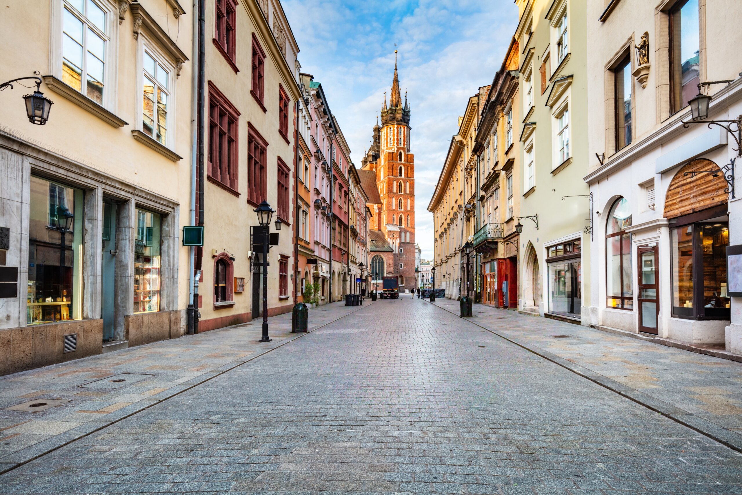 Old town street in Cracow, Poland with St. Mary's Basilica
