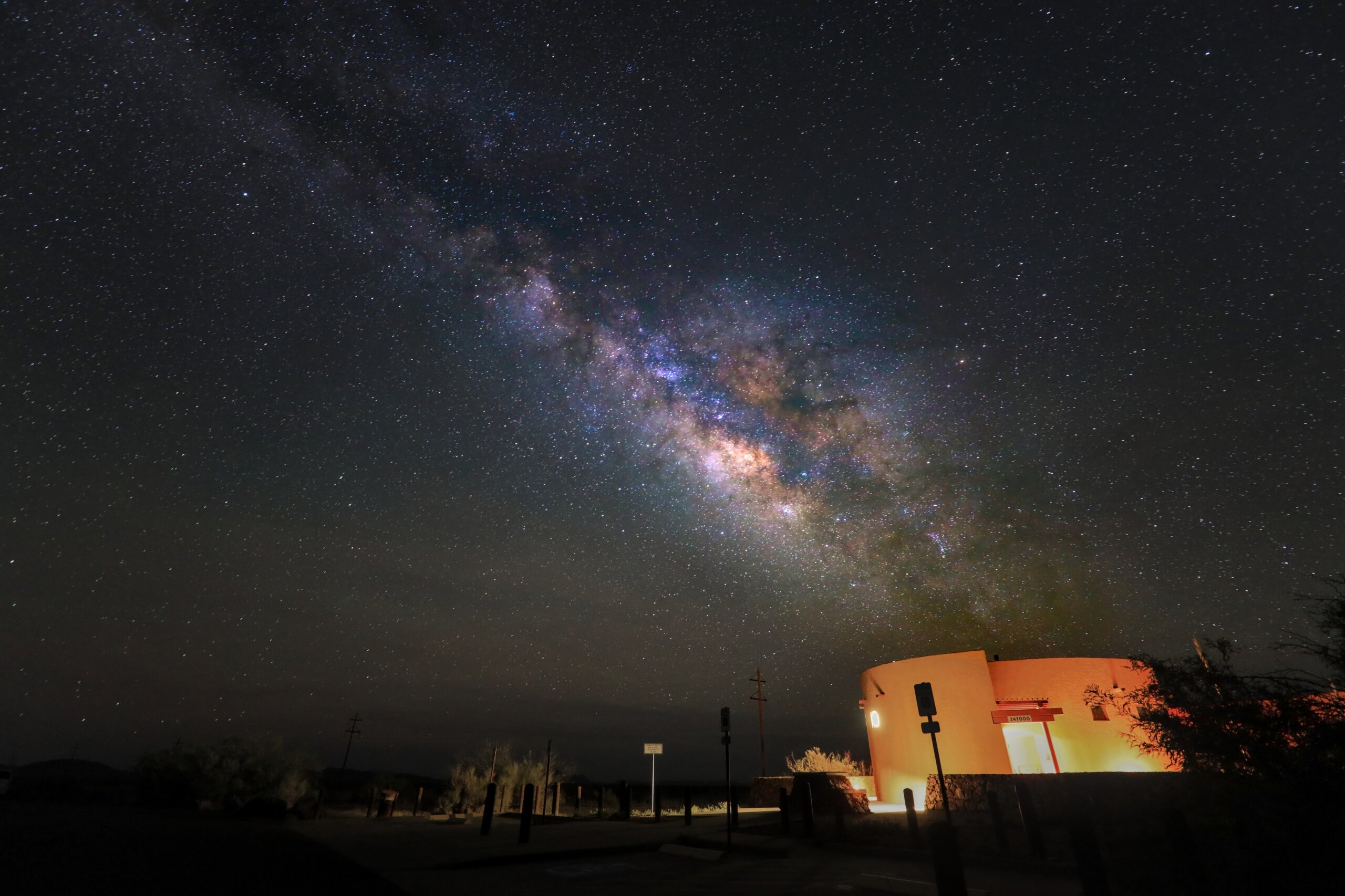 Marfa lights observation area under the glow of the Milky Way galactic core.
