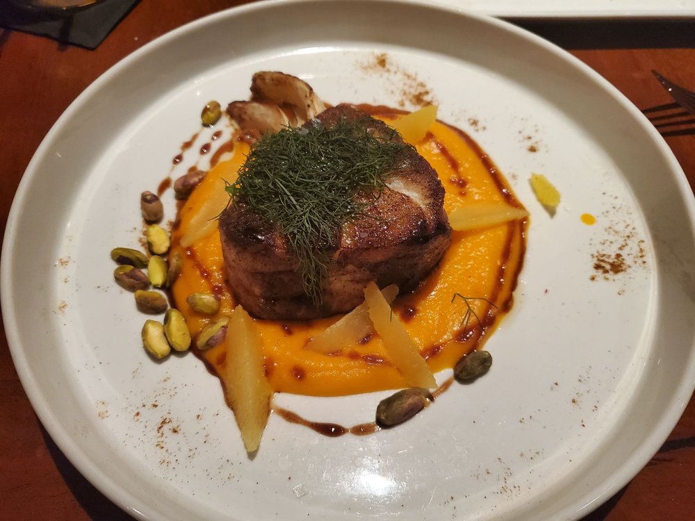 Plated gourmet entrée at Different Pointe of View in Phoenix, one of the best restaurants for food lovers in the U.S. with desert views.