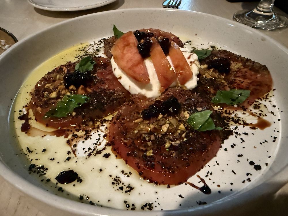 Tomato and burrata salad at Table 28 in Little Rock, a modern fine dining destination in the U.S. for creative Southern cuisine.