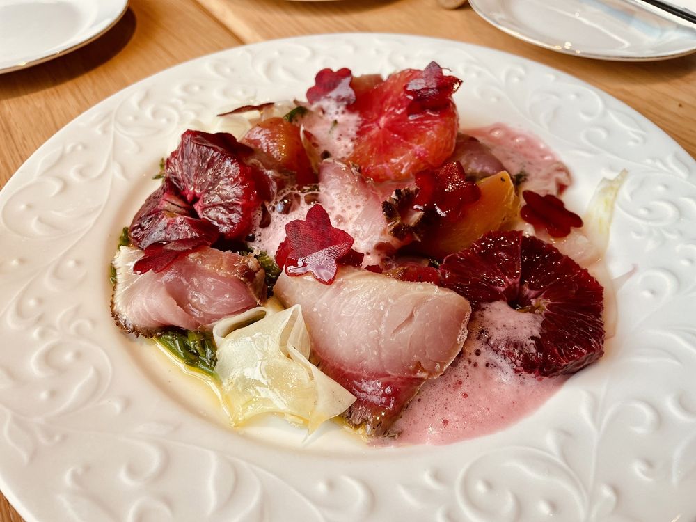 Hiramasa carpaccio with citrus and foam at Rocca in Tampa, one of the top fine dining destinations in the U.S. for Italian cuisine.