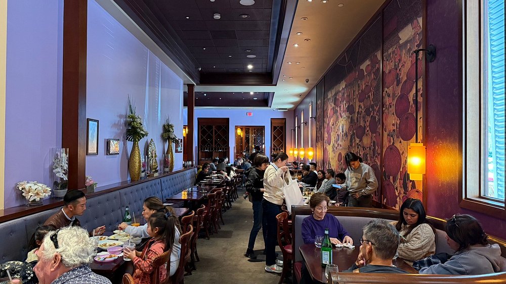 Guests dining at Lotus of Siam, a Thai favorite renowned for its authentic cuisine and one of the toughest restaurant reservations in Las Vegas.