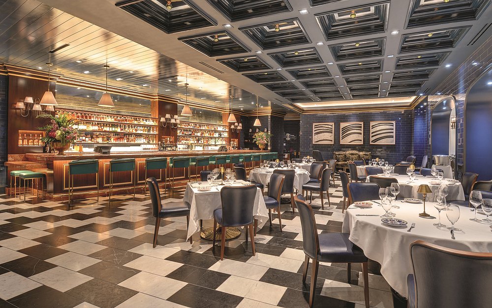 Vintage-inspired interior of Carbone at Aria Resort, one of the toughest restaurant reservations in Las Vegas for Italian-American fine dining.