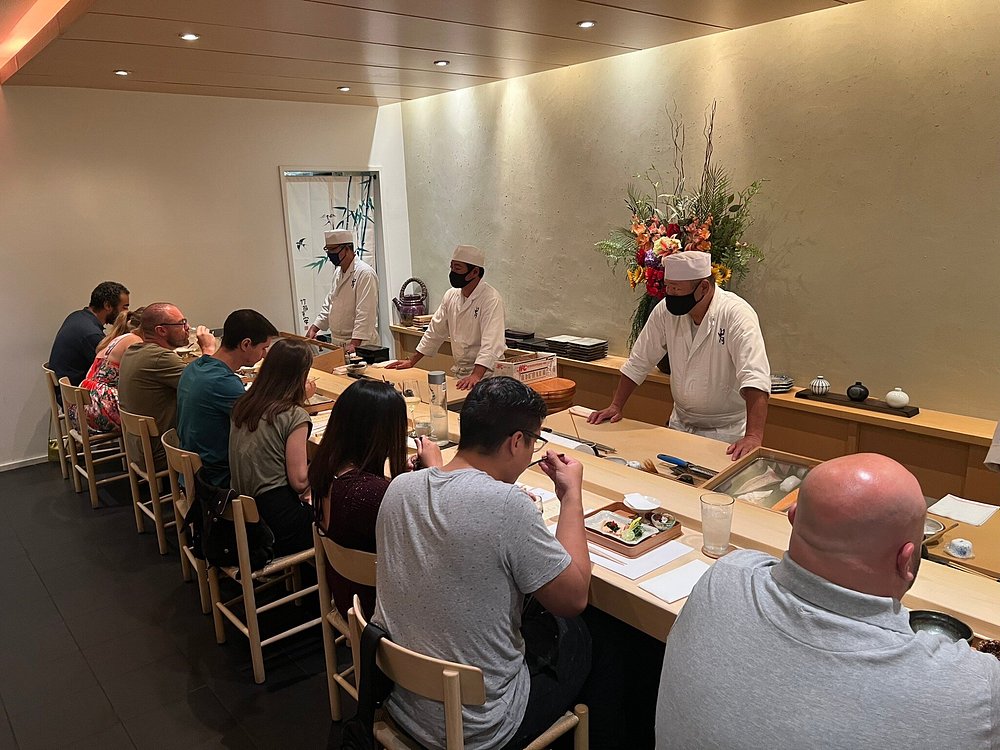 Guests enjoying Edomae sushi at Kabuto, an intimate omakase restaurant offering one of the toughest restaurant reservations in Las Vegas.