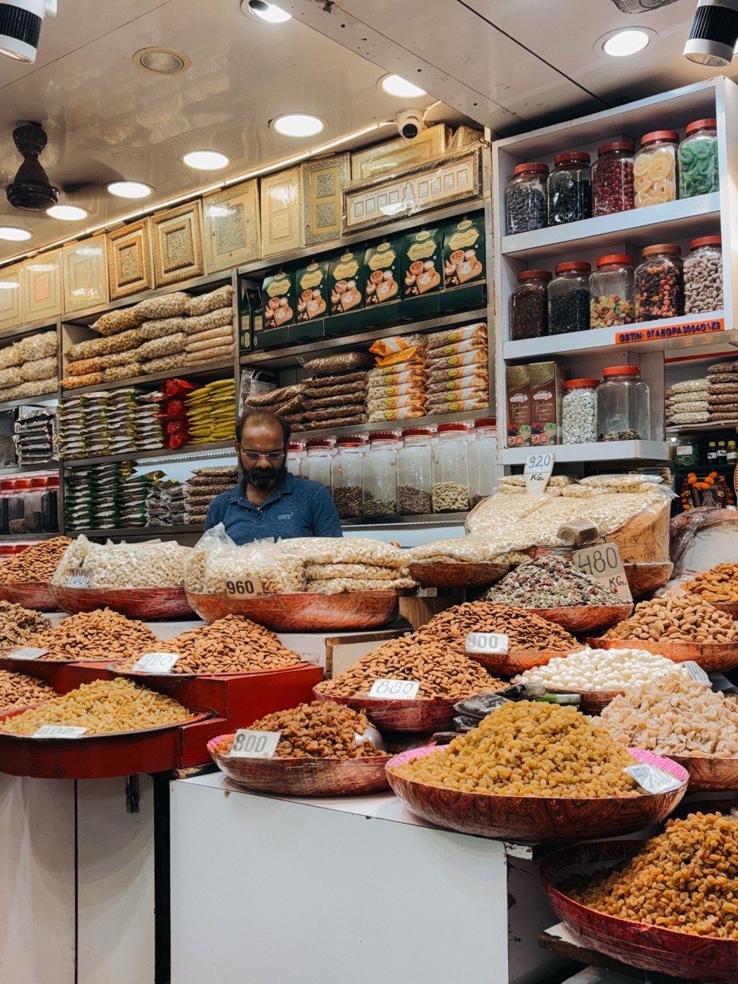 Spices, dried fruits and nuts on display in the streets of Delhi. 
