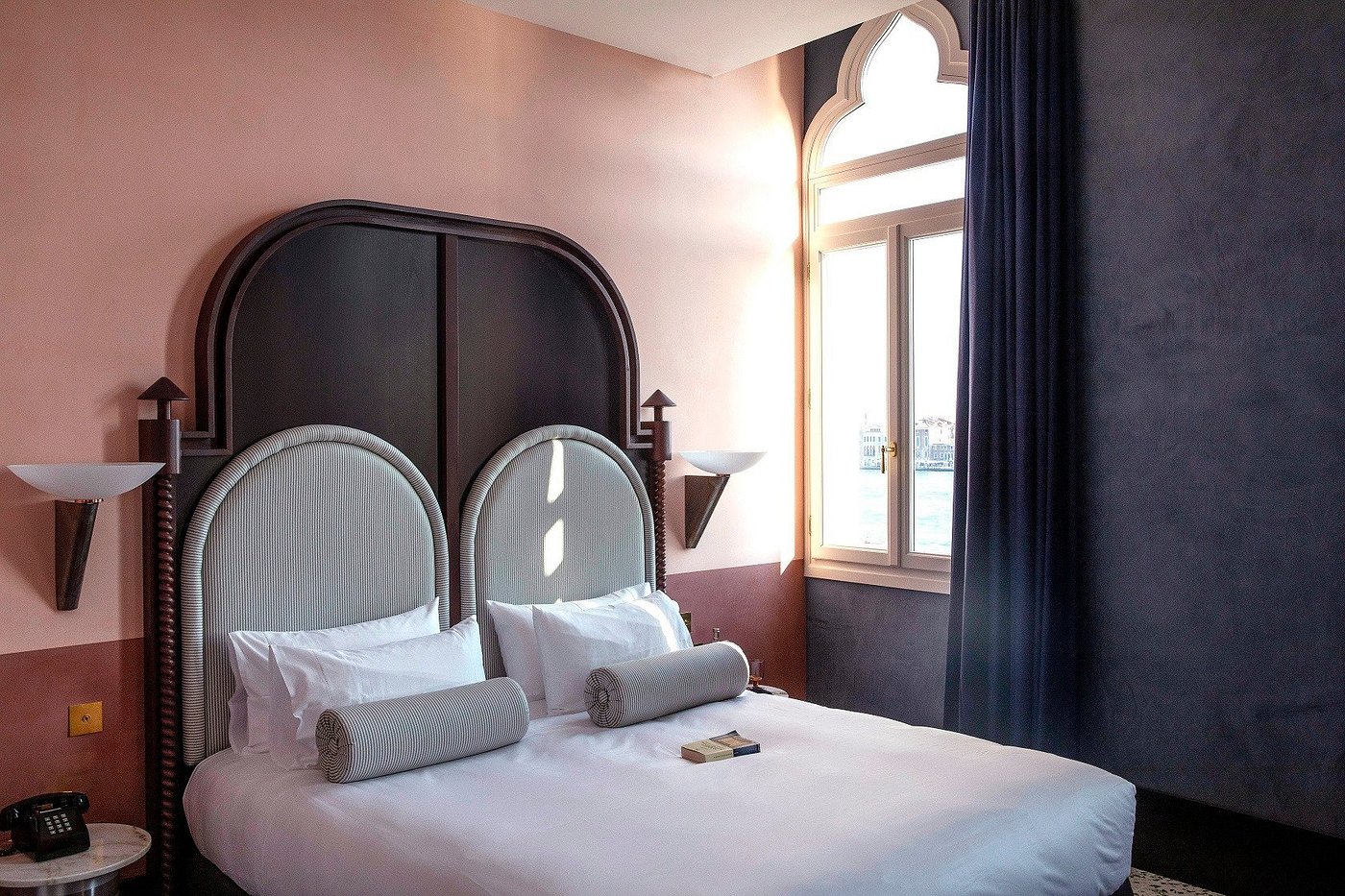Stylish room at Il Palazzo Experimental in Dorsoduro, Venice, with maritime design touches and lagoon views.