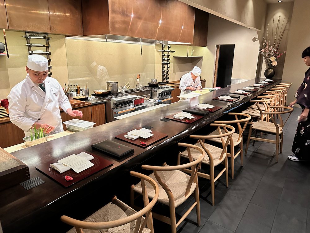 Chefs preparing omakase courses at Kaiseki Sanga, one of the toughest restaurant reservations in Las Vegas for authentic Japanese fine dining.