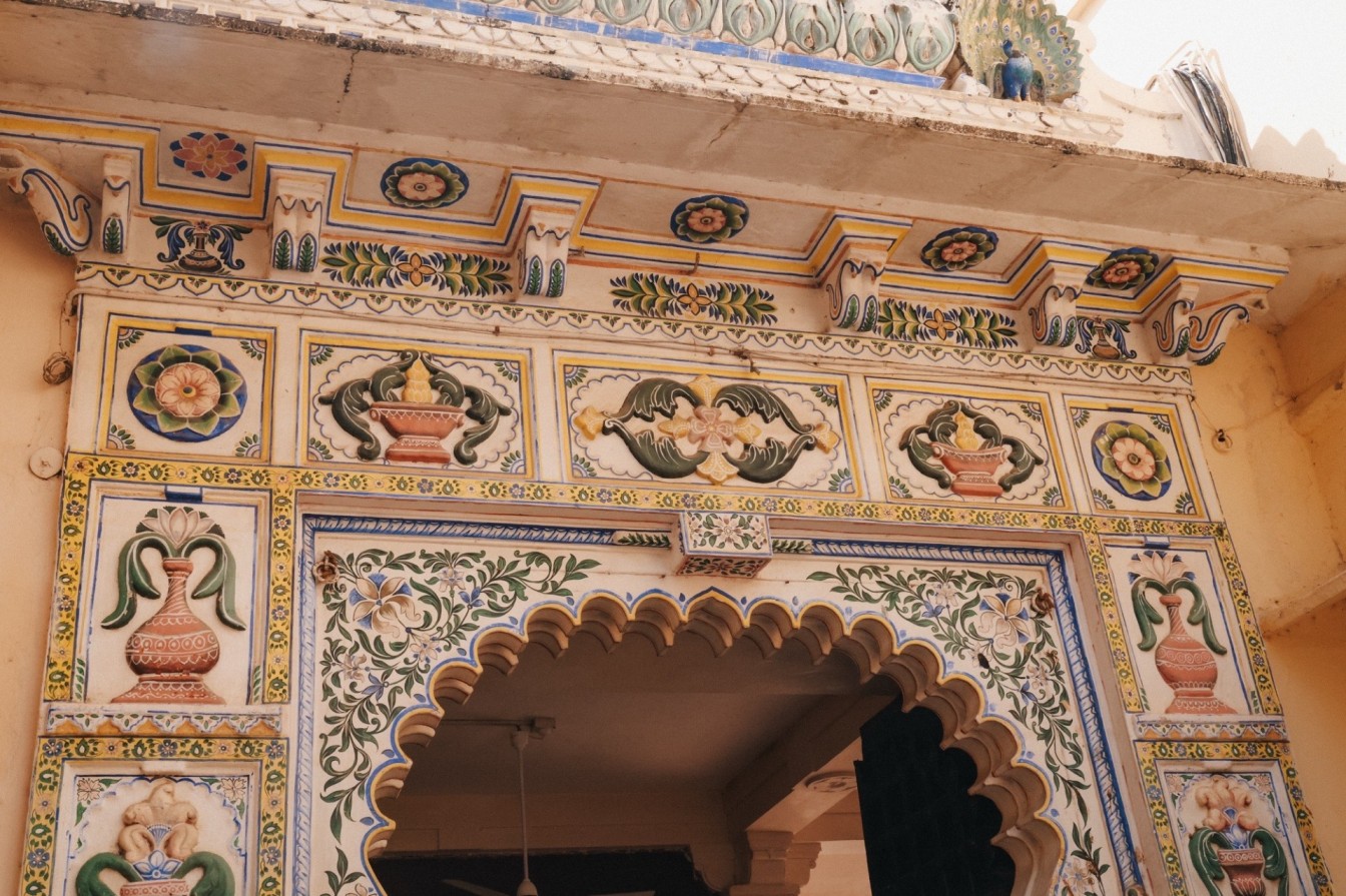 Colorful temple doorway representing travel fatigue and repetitive sightseeing experiences