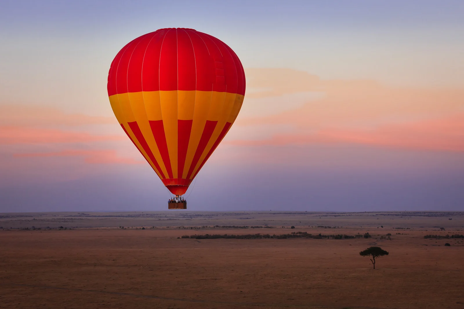 Hot-air balloon over Kenya’s savanna — an adventurous safari vacation for middle-class retirees.