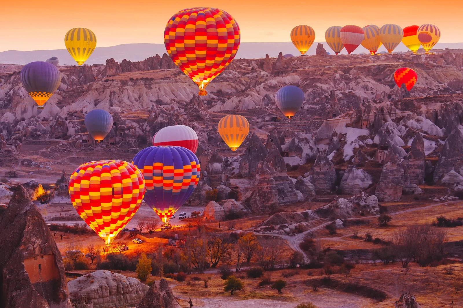 Colorful balloons over Cappadocia’s rock valleys — a stunning retirement bucket list experience.