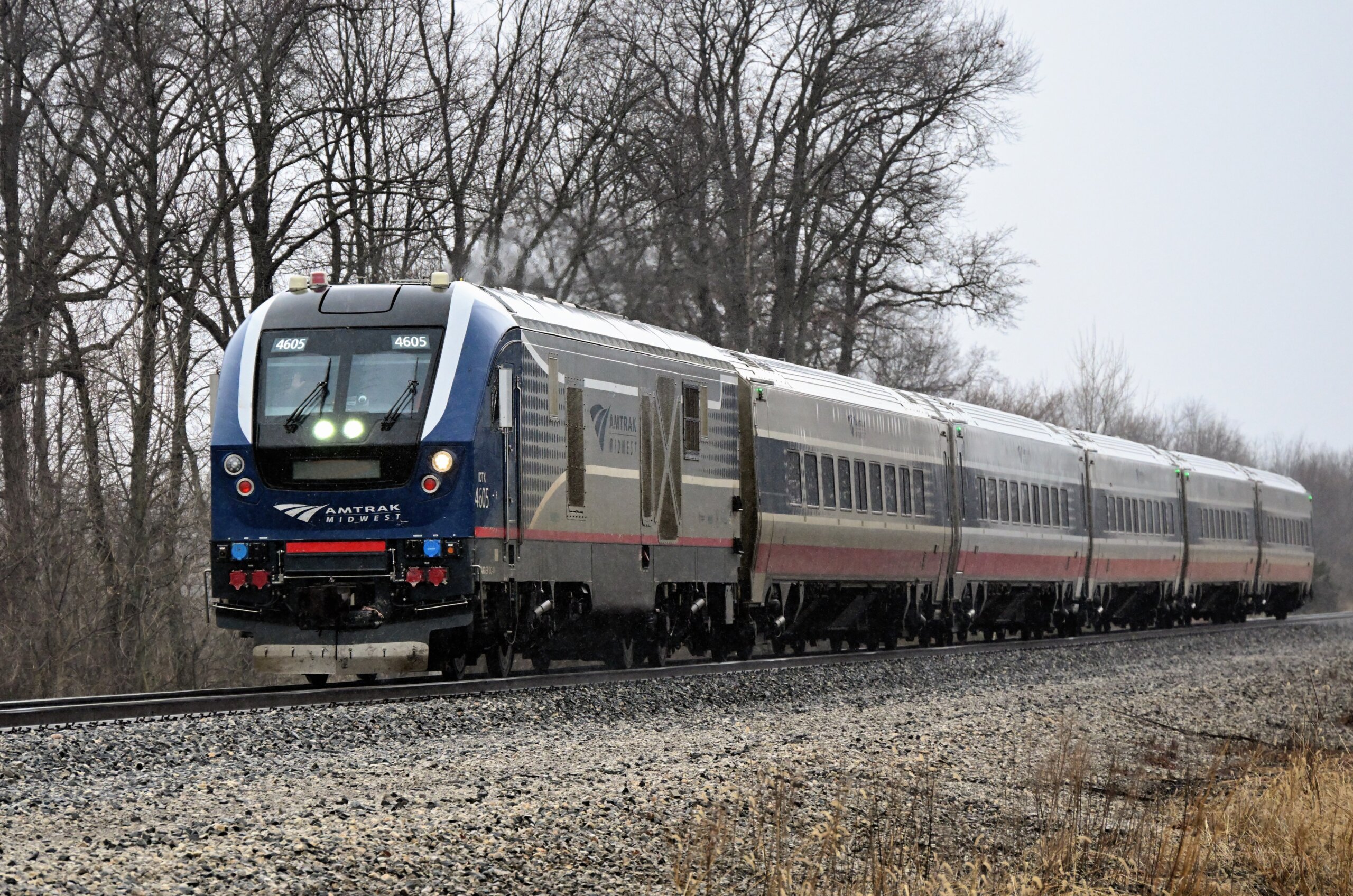 Amtrak's eastbound Wolverine train maintinaing track speed in the rain while destined for Pontiac, Michigan. The train had originated in Chicago.