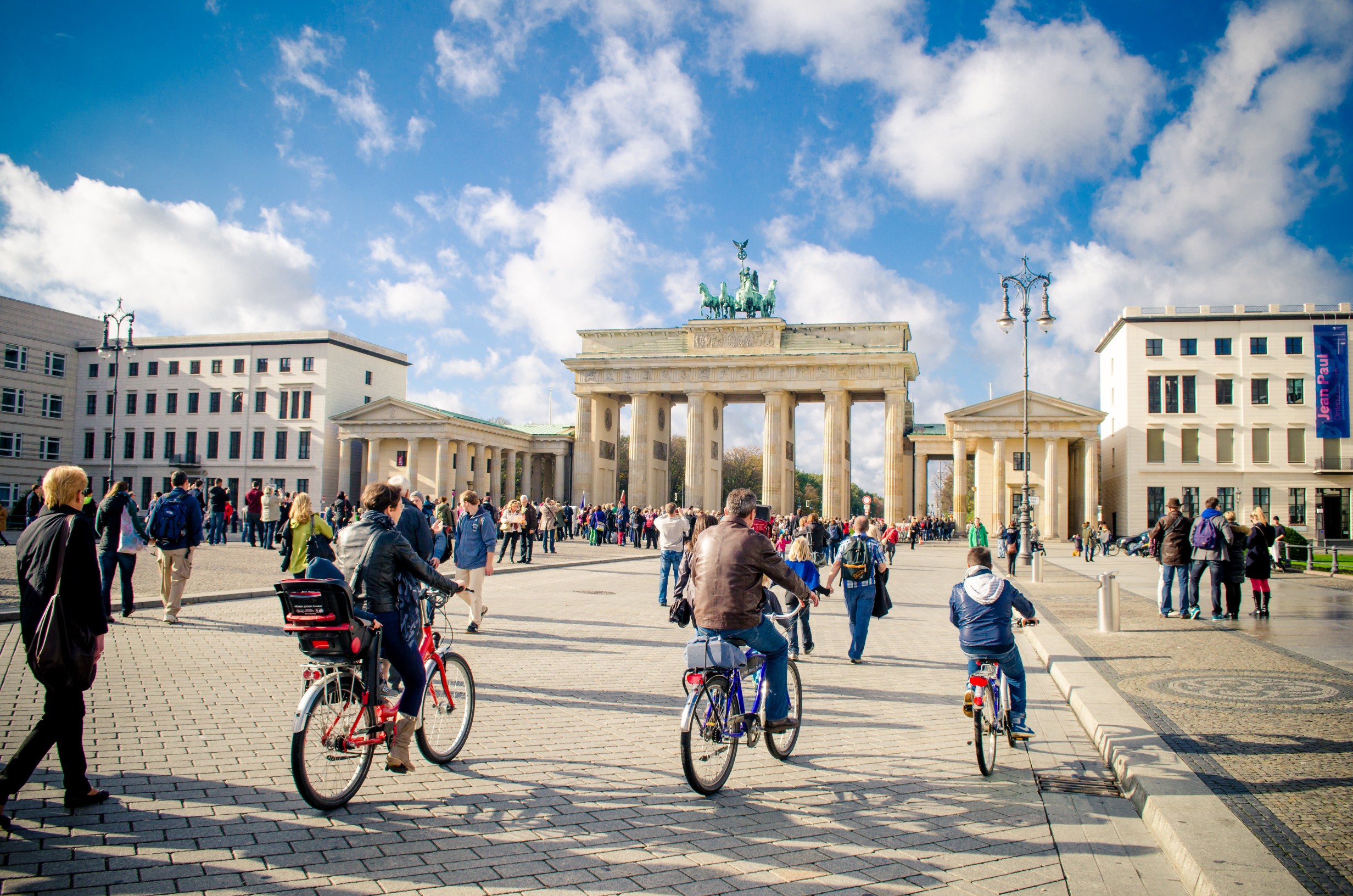 People cycling near Brandenburg Gate, Berlin, Germany