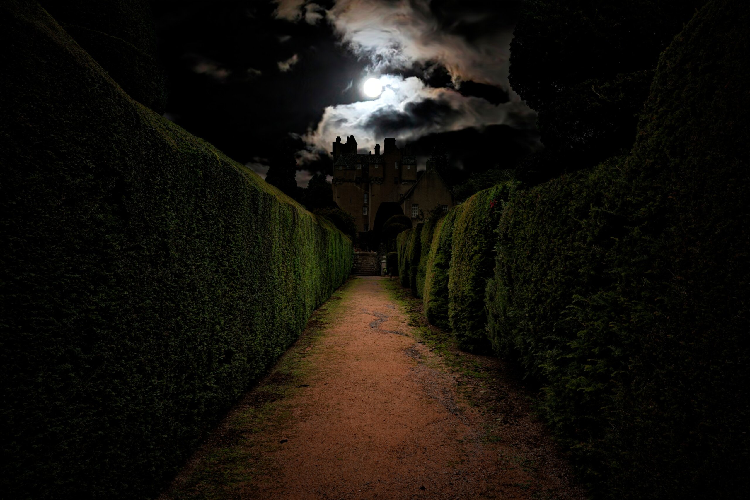 Dark path leading to a haunted castle under a full moon in Ireland or Scotland, evoking mystery and ghostly legends.