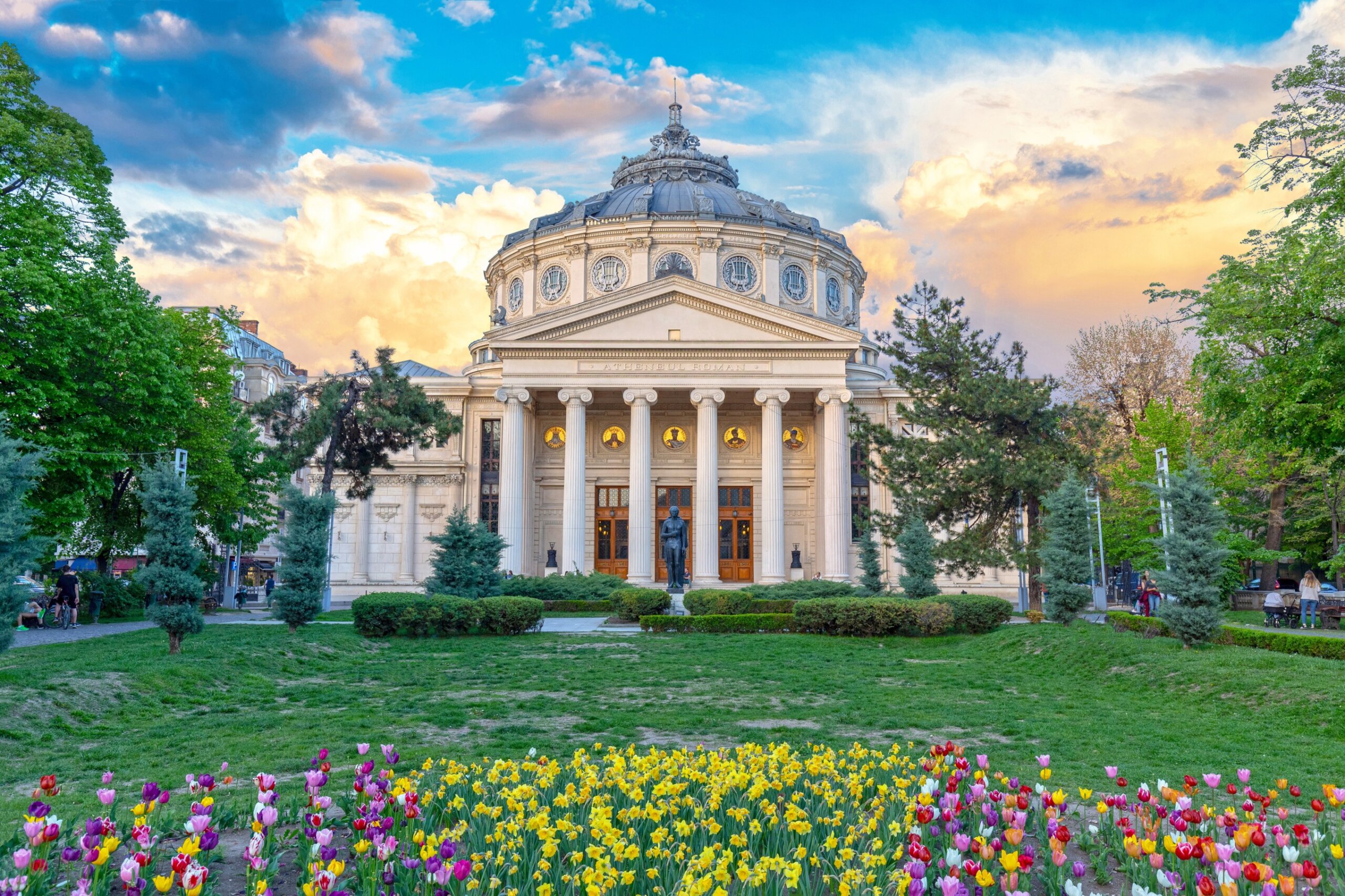 The Romanian Athenaeum in Bucharest at sunset, representing European travel safety and awareness of the most dangerous cities in Europe.