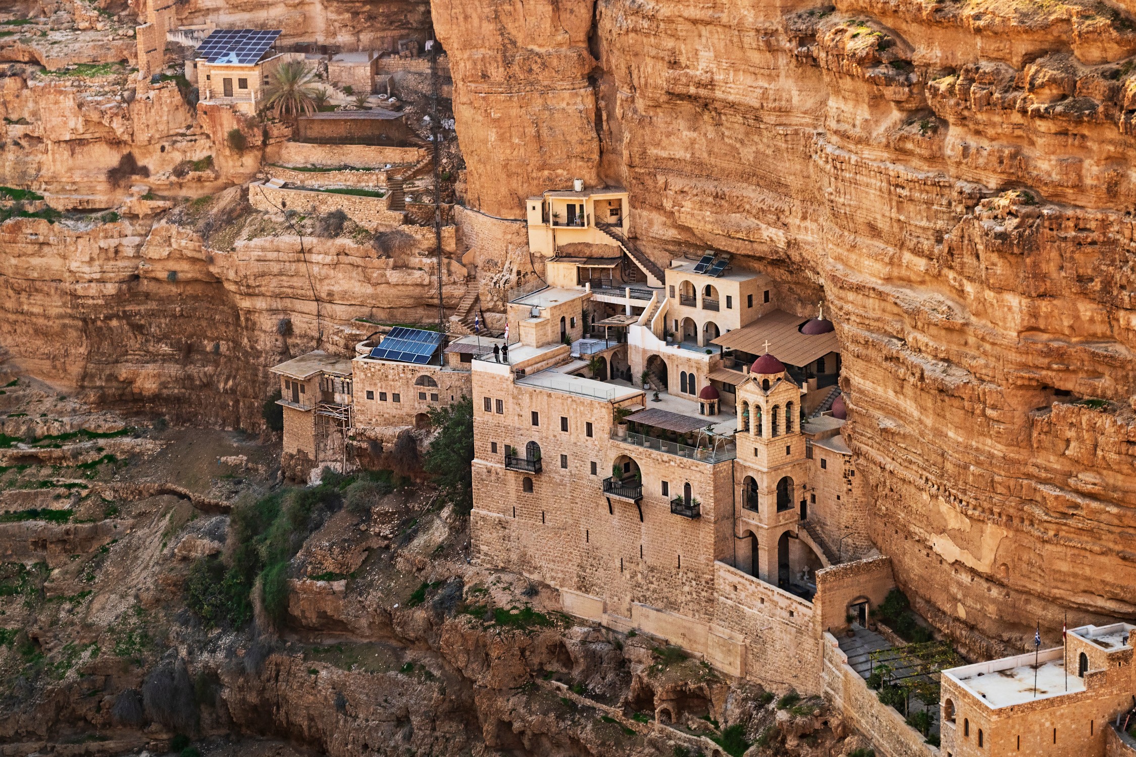 western section of the ancient saint george's monastery built into the limestone cliffs and caves of wadi qelt nahal prat near jericho in the west bank