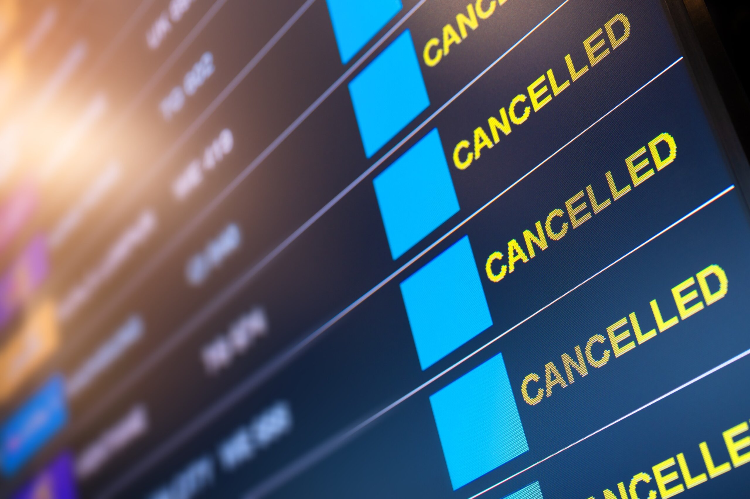 Flights cancelled on information timetable board in airport due to government shutdown