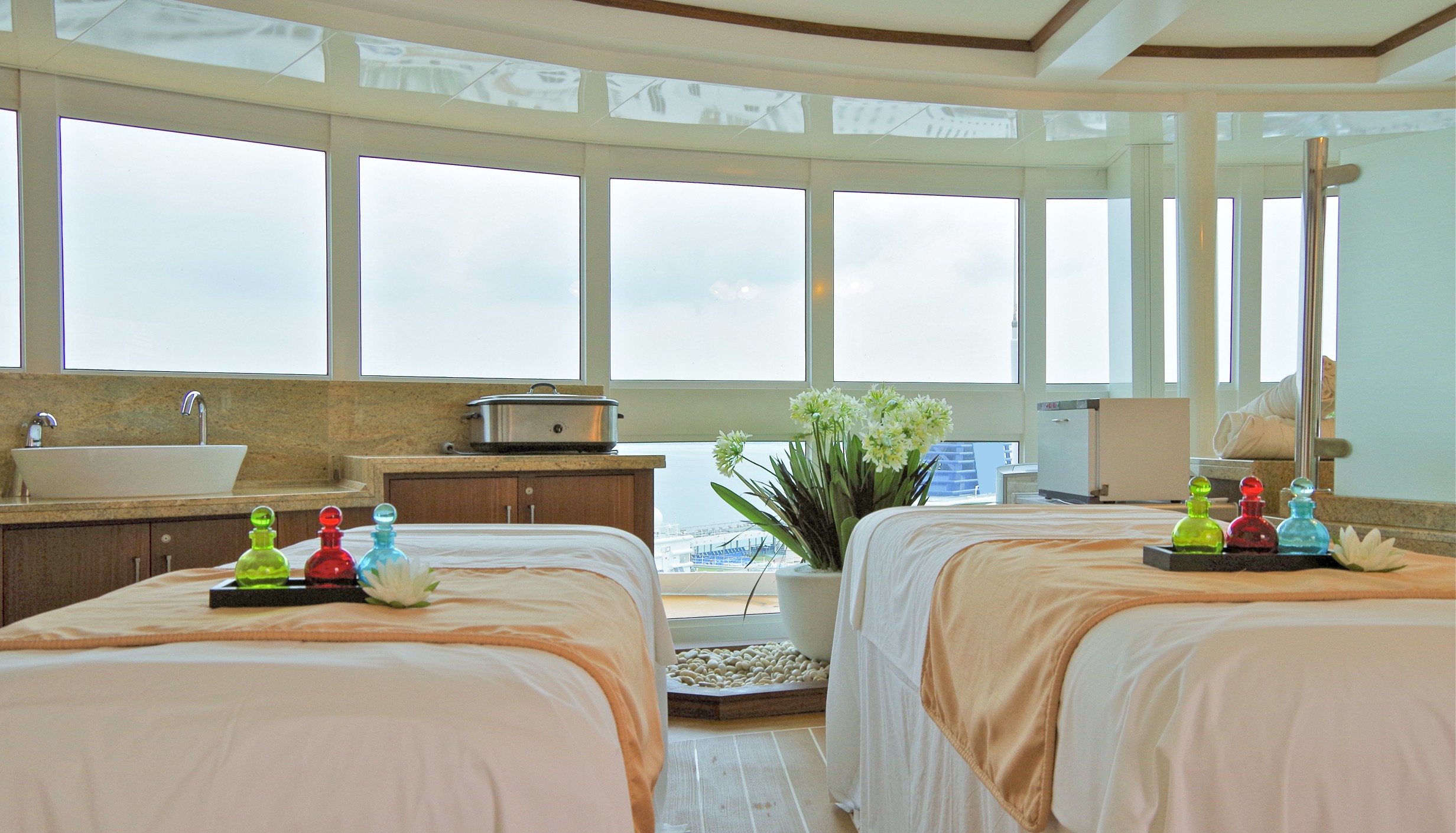 Exclusive massage room or cabana inside spa or wellness thermal suite of modern luxury cruiseship or cruise ship liner
