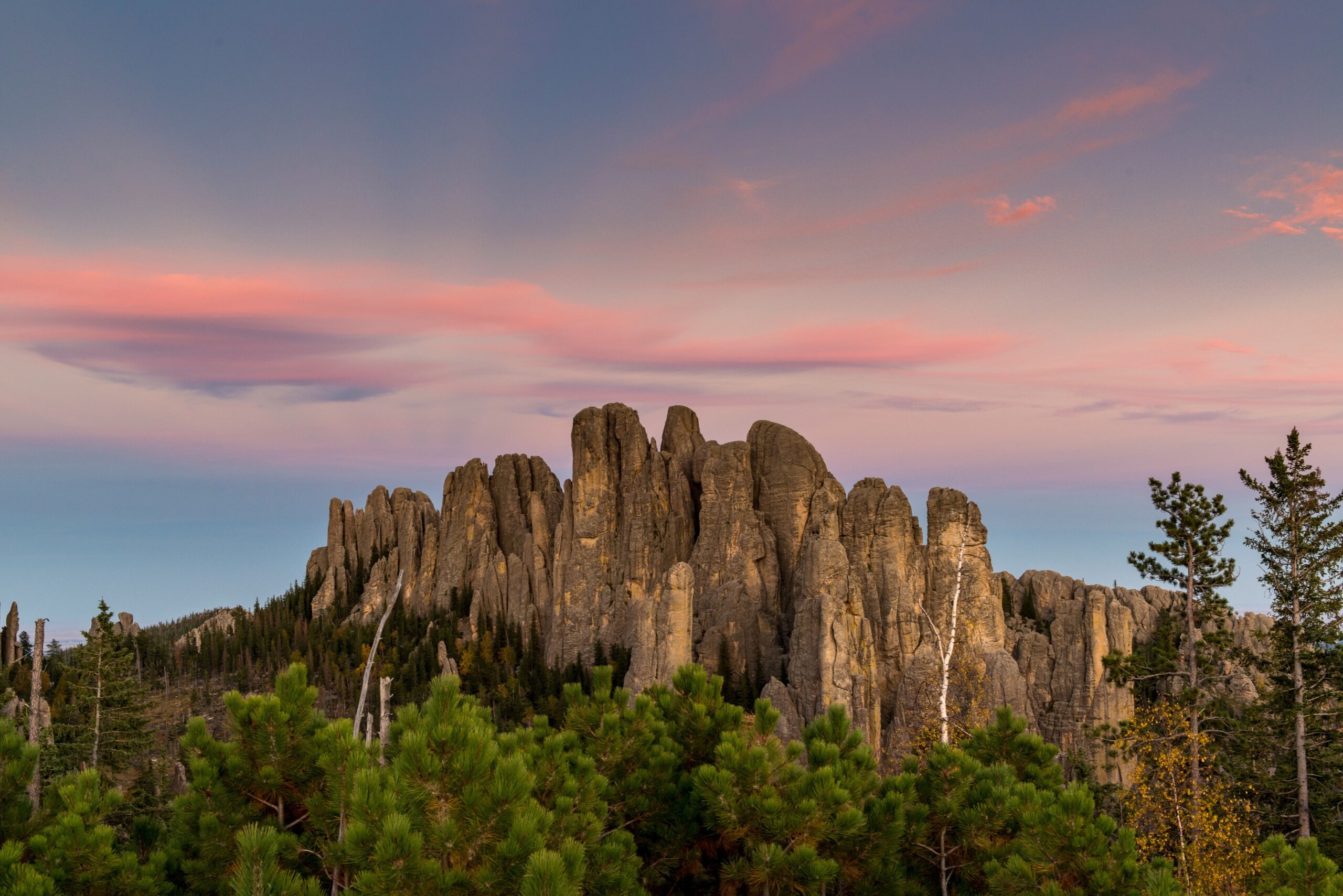 Landscape of Cathedral Spires at sunset, Custer State Park, Black Hills, South Dakota. A popular rock climbing destination.
