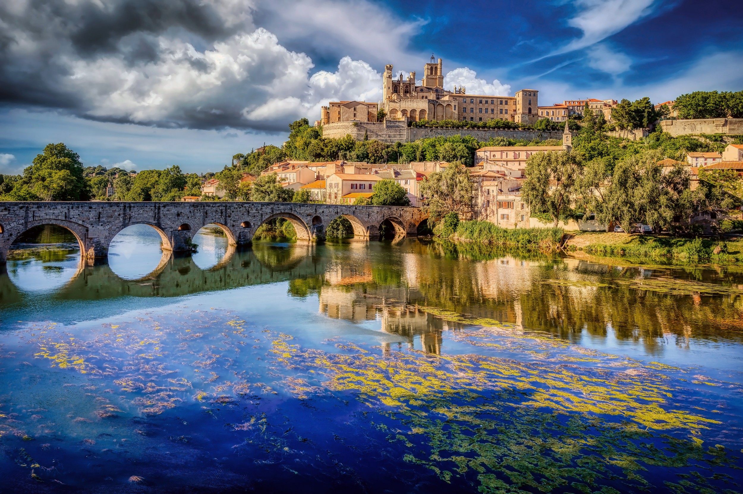 The Old Bridge (Pont Vieux) at Beziers and Sainte Nazaire Cathedral, overlooking the River Orb, in the Herault Department of the Languedoc region of France