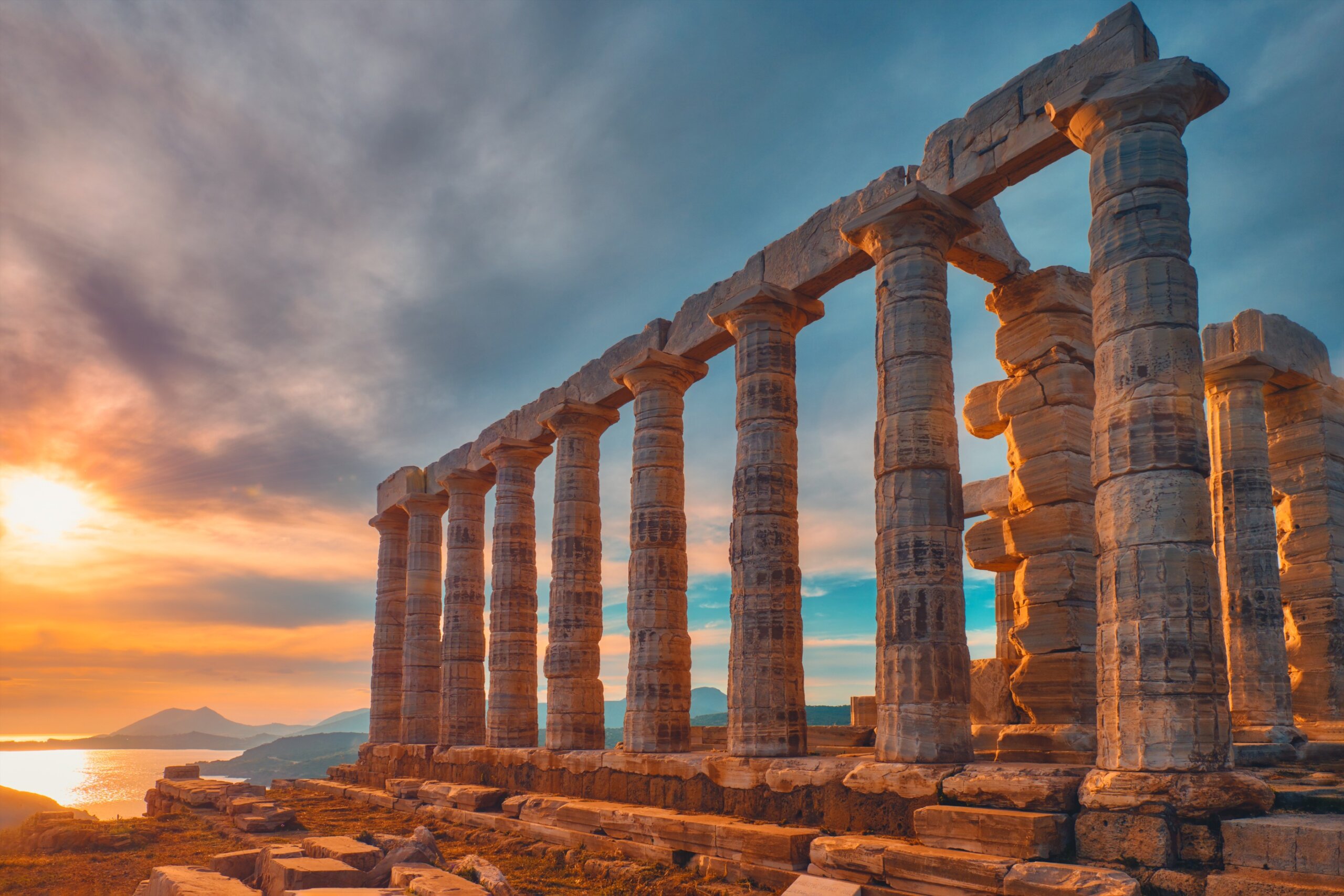 Poseidon temple ruins on Cape Sounio on sunset, Greece
