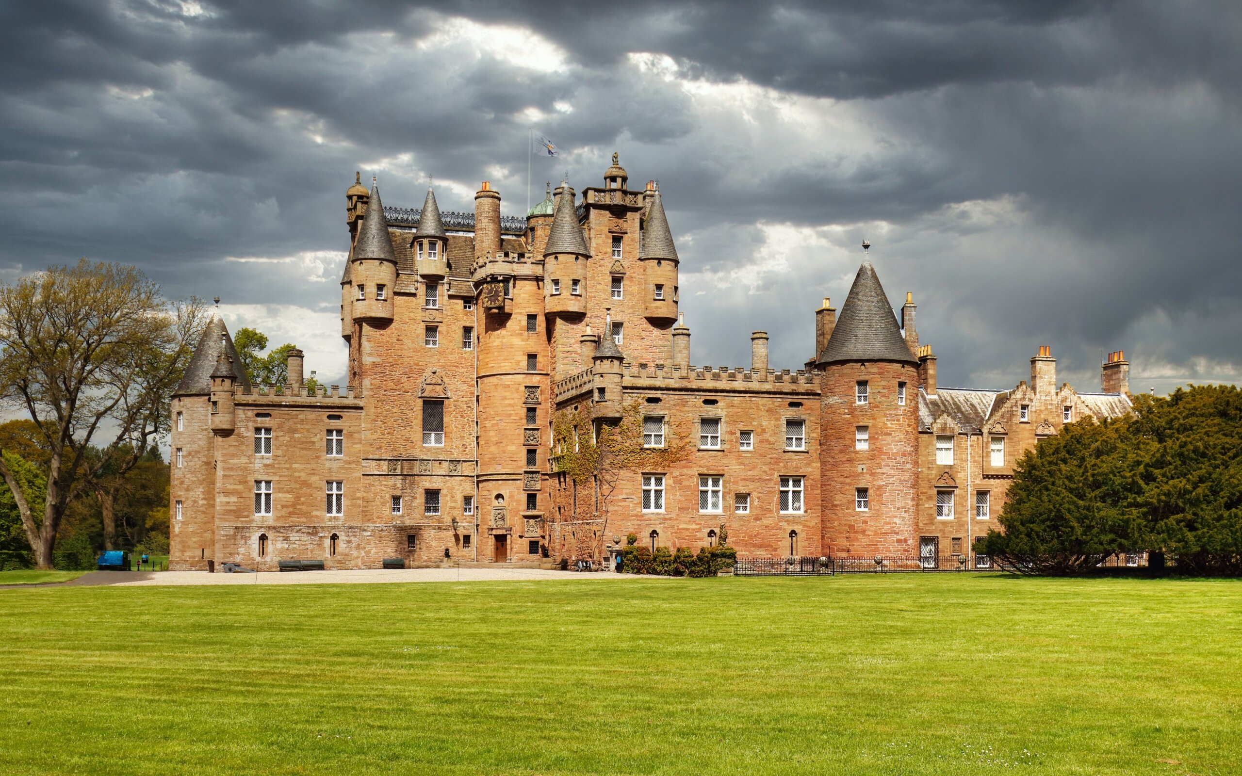 Glamis castle in scotland with dramatic sky
