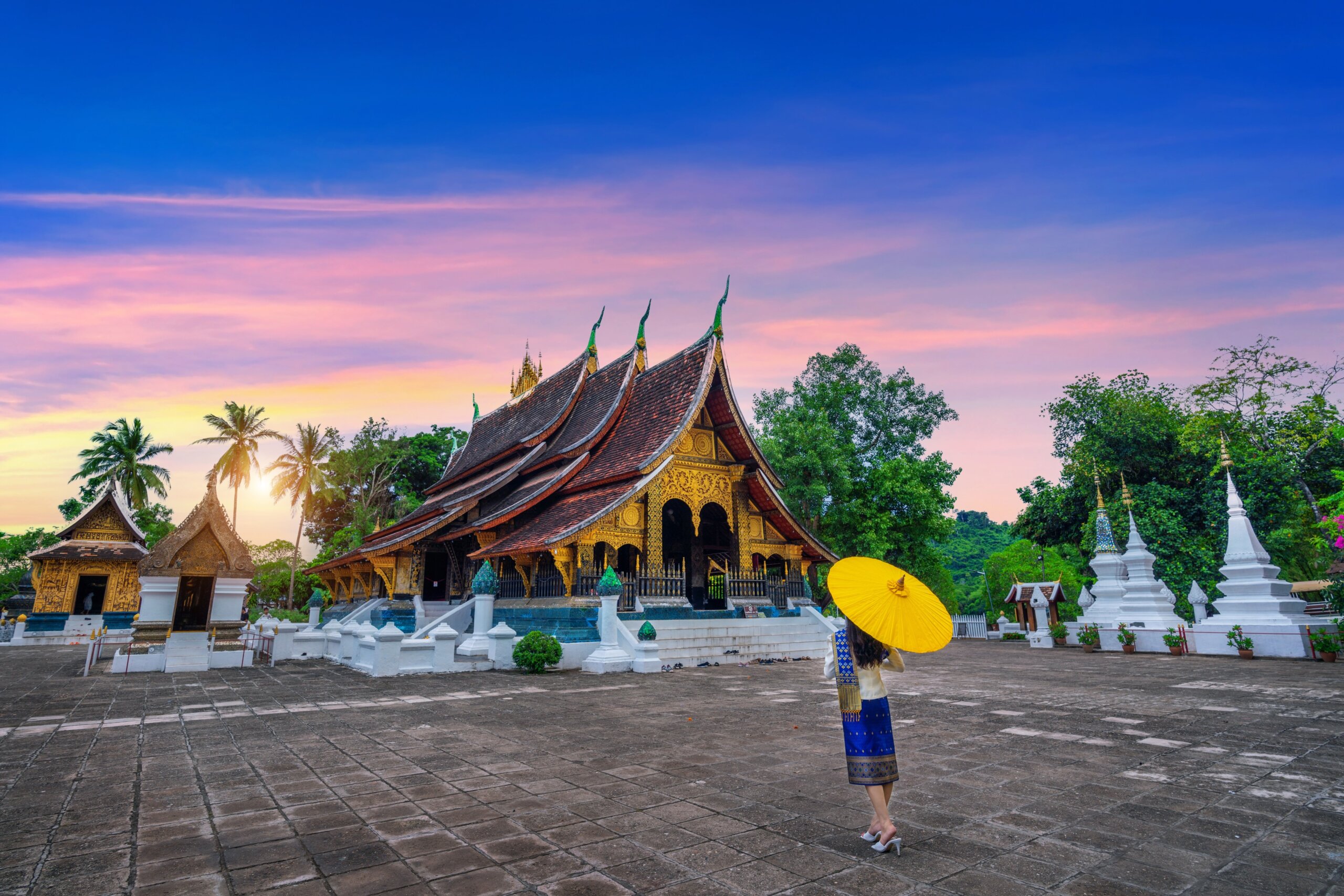 Asian woman wearing laos traditional at Wat Xieng Thong (Golden City Temple) in Luang Prabang, Laos.
