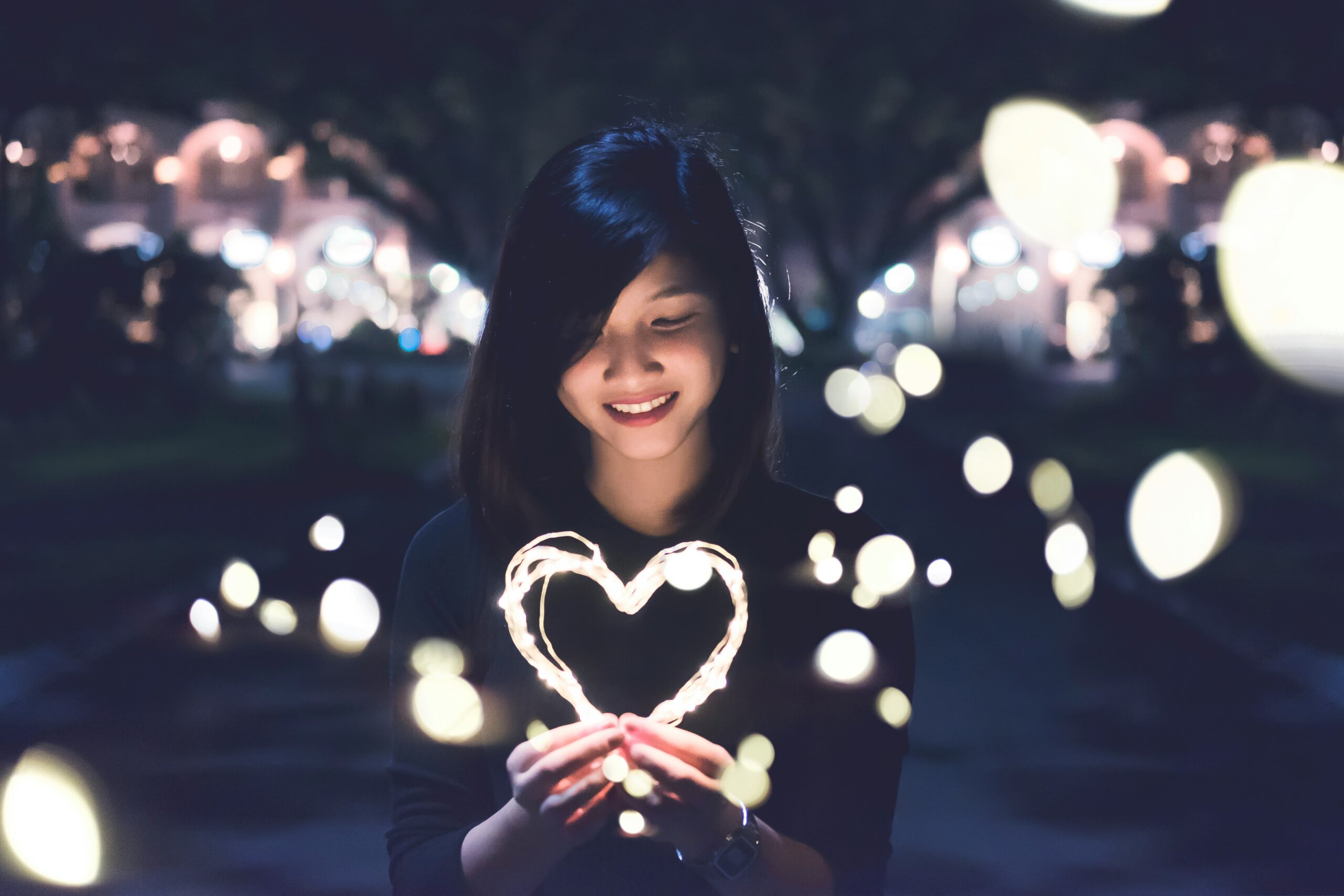 woman with string light heart