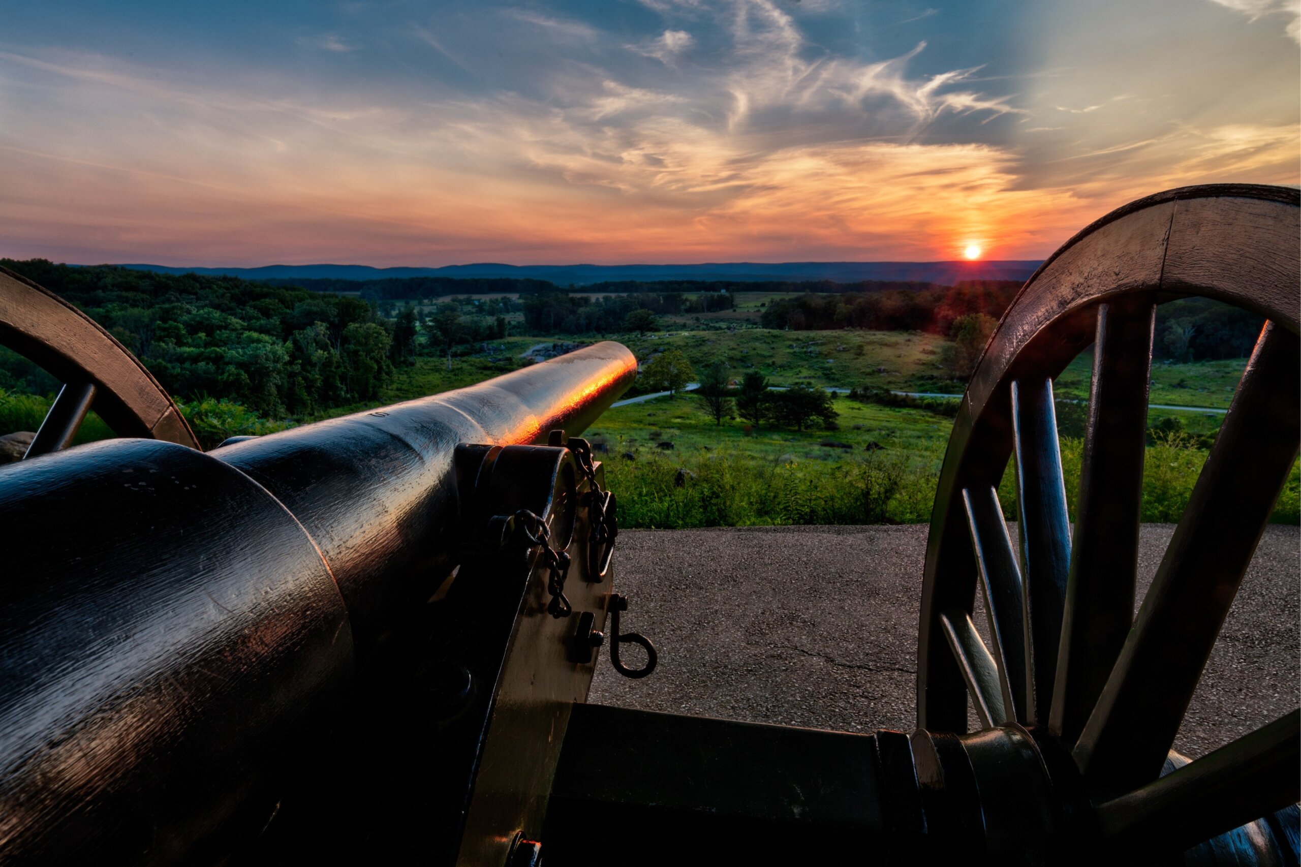 Cannon overlooking Gettysburg battlefield at sunrise in Pennsylvania