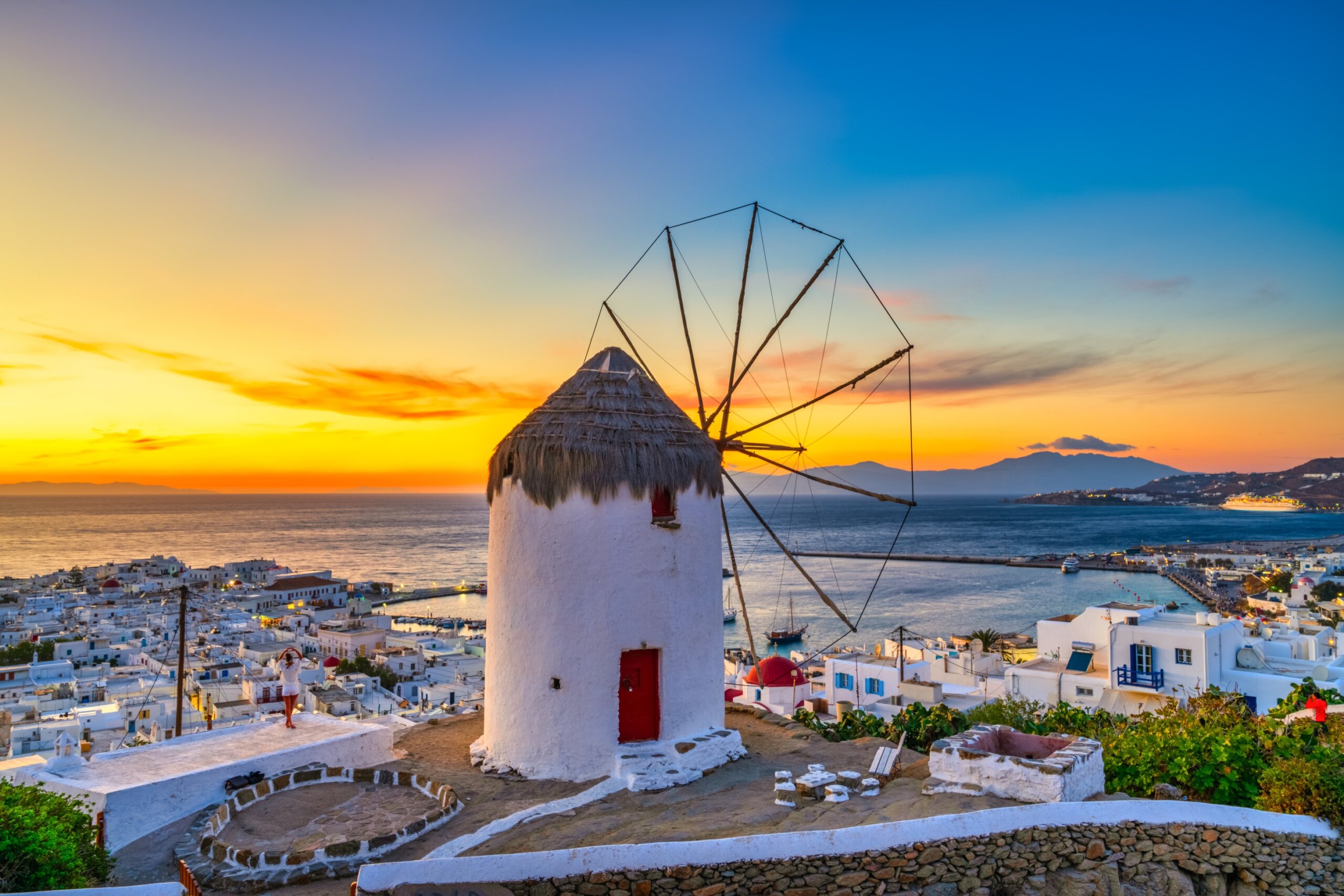 Traditional Greek windmill at sunset in Mykonos island. Greece
