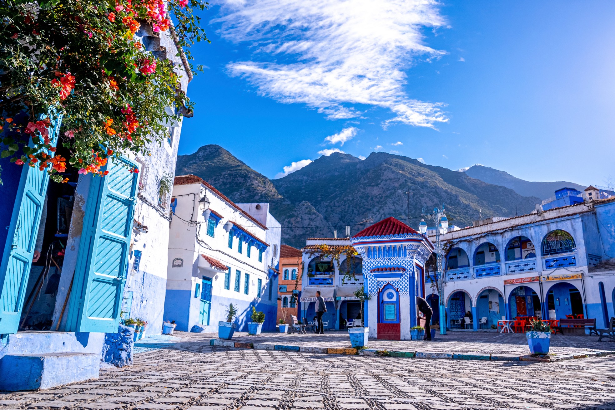Public drinking water outlet between restaurant and traditional house at Chefchaouen, the blue city in the Morocco
