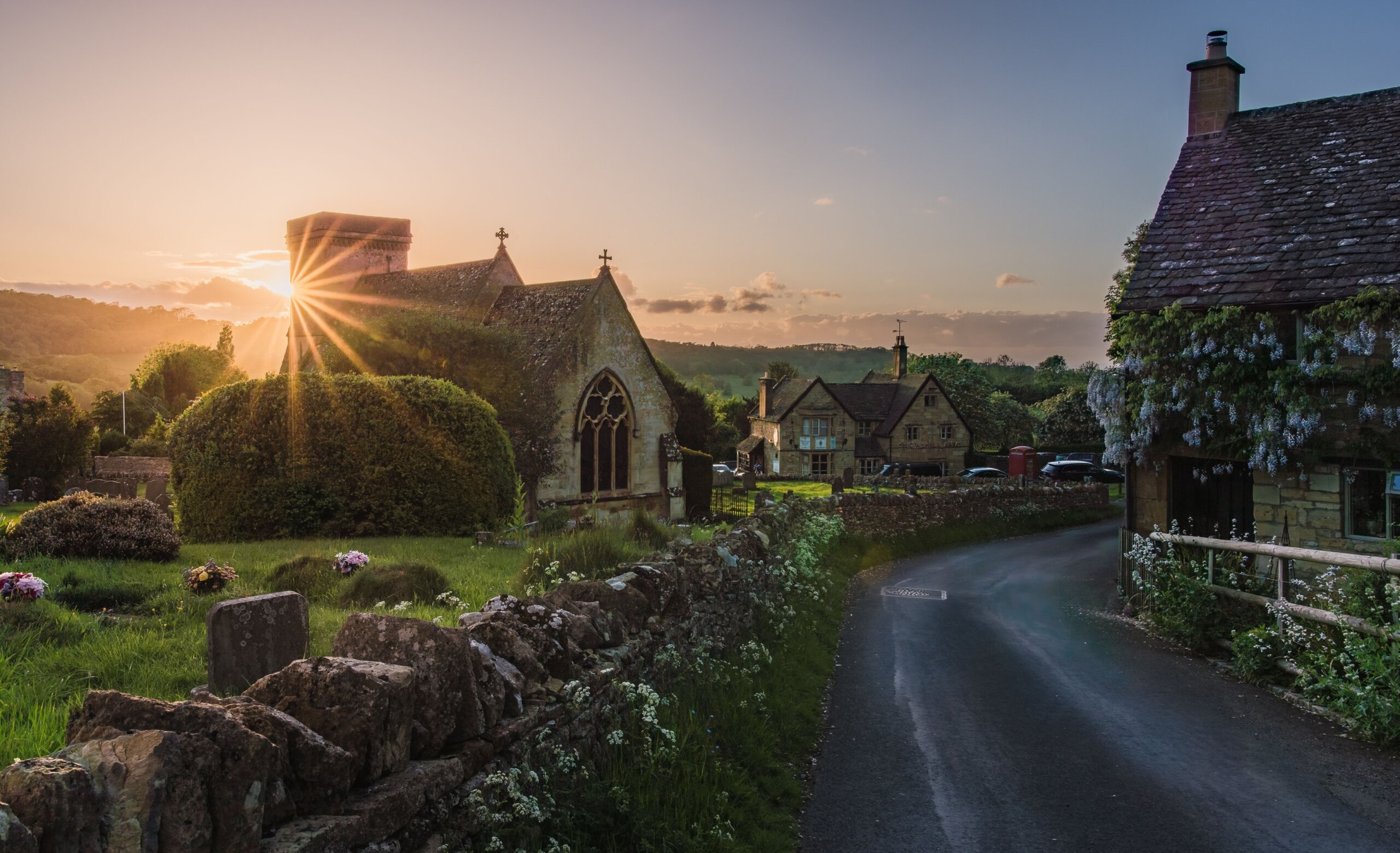Scenic sunset at St. Barnabas Church in Snowshill, Gloucestershire, England