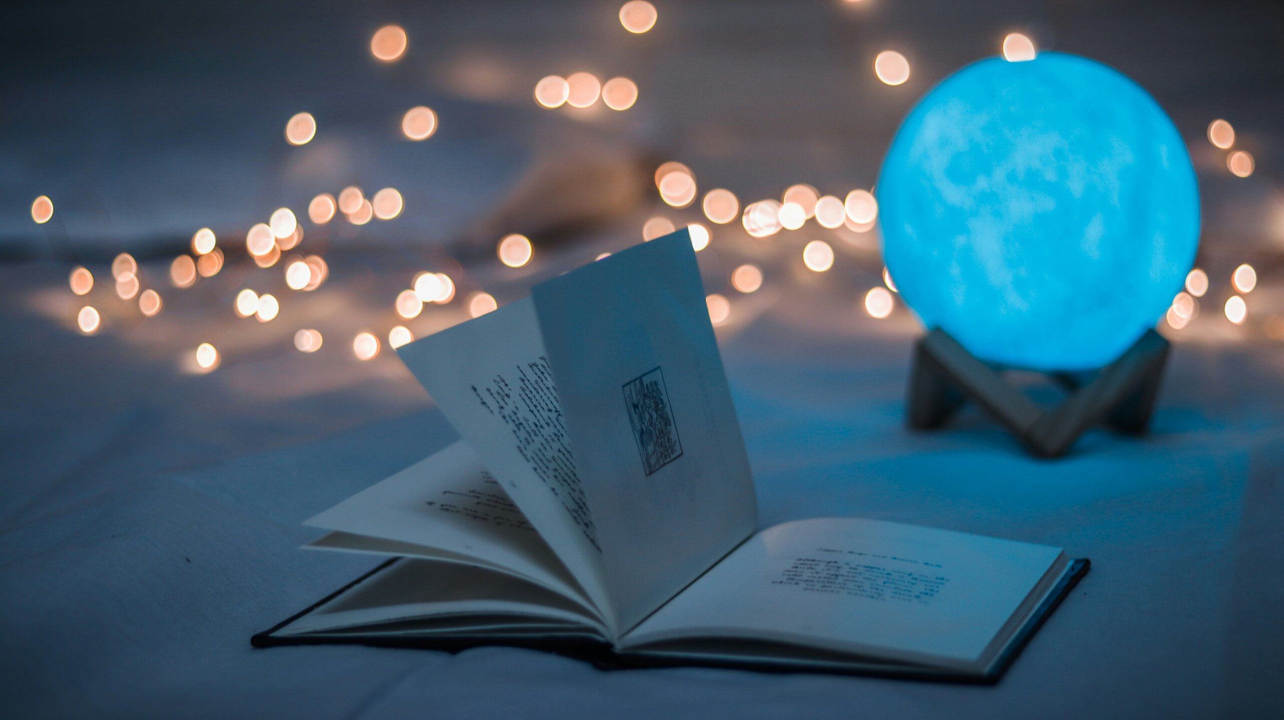Open book in soft lighting representing America’s best book towns and book lover travel destinations