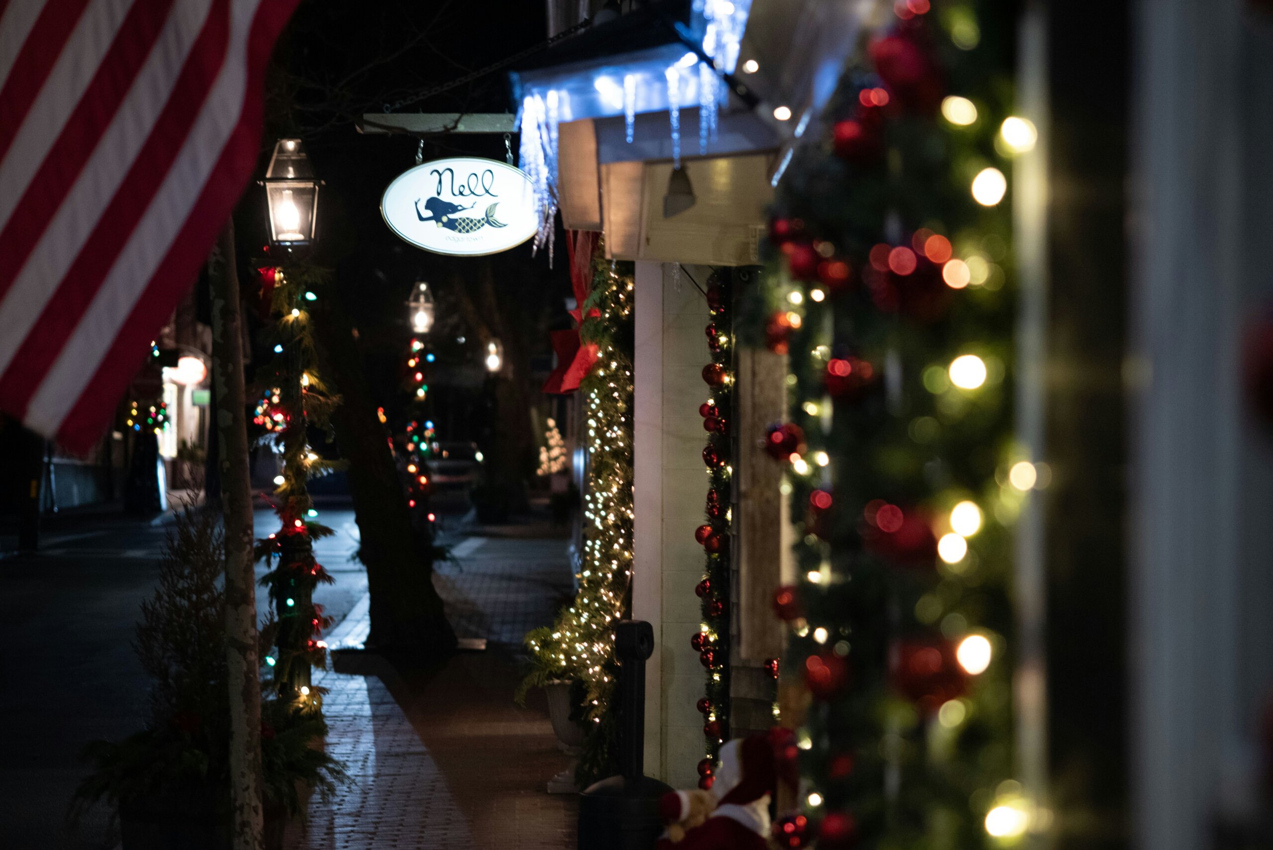 Charming small town Main Street decorated with holiday lights during winter travel season